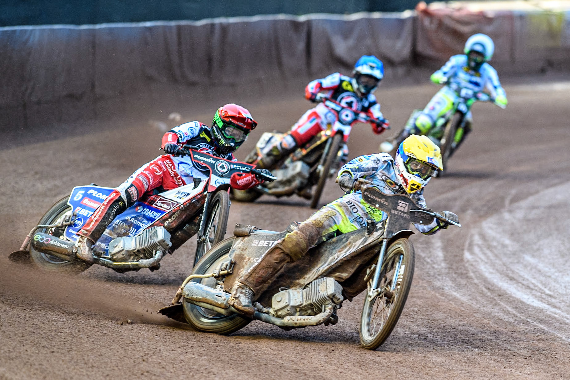 Oxford Spires' Maciej Janowski in Yellow leading Belle Vue Aces' Dan Bewley in Red, Belle Vue Aces' Connor Mountain in Blue and Oxford Spires' Charles Wright in White during the Rowe Motor Oil Premiership match between Belle Vue Aces and Oxford Spires at the National Speedway Stadium, Manchester on Monday 13th May 2024. (Photo: Ian Charles | MI News)