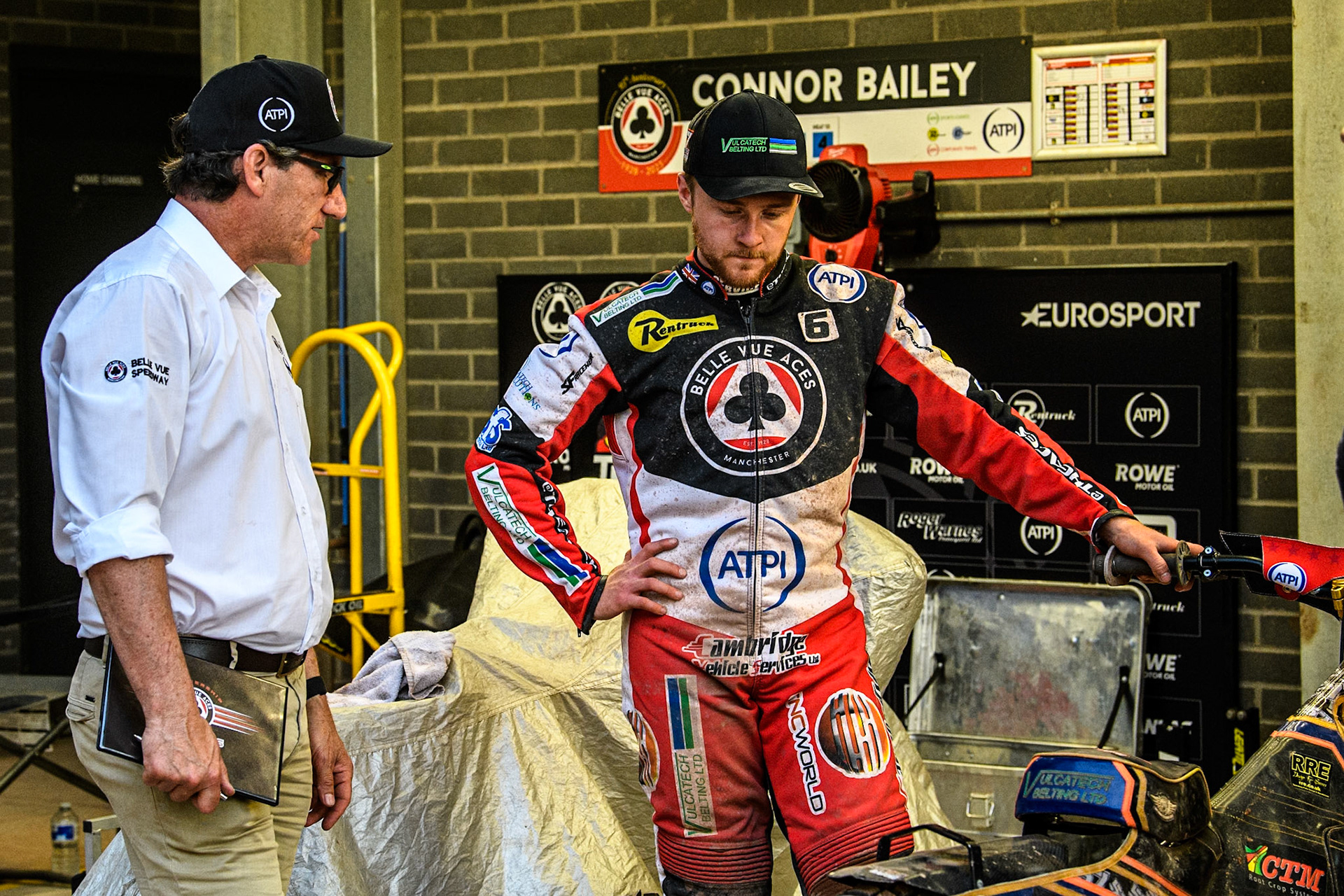 Belle Vue Aces' Team Manager Mark Lemon (Left) chats with Belle Vue Aces' Connor Mountain during the Rowe Motor Oil Premiership match between Belle Vue Aces and Leicester Lions at the National Speedway Stadium, Manchester on Monday 24th June 2024. (Photo: Ian Charles | MI News)