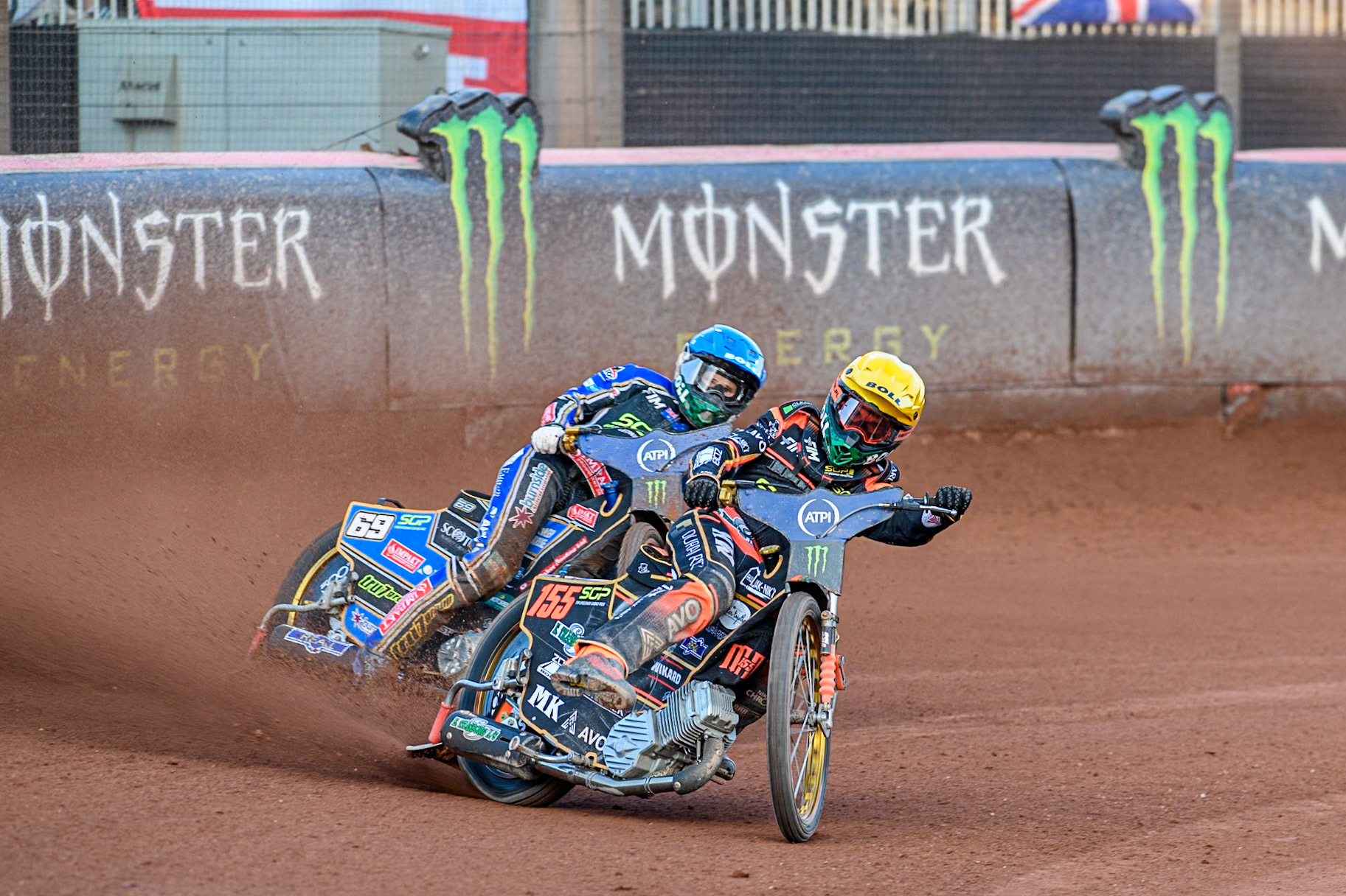 Mikkel Michelsen (155) of Denmark in Yellow leading Jason Doyle (69) of Australia in Blue during the ATPI FIM Speedway Grand Prix Round 5 at the National Speedway Stadium, Manchester, on Saturday 14th June 2025. (Photo: Ian Charles | MI News)