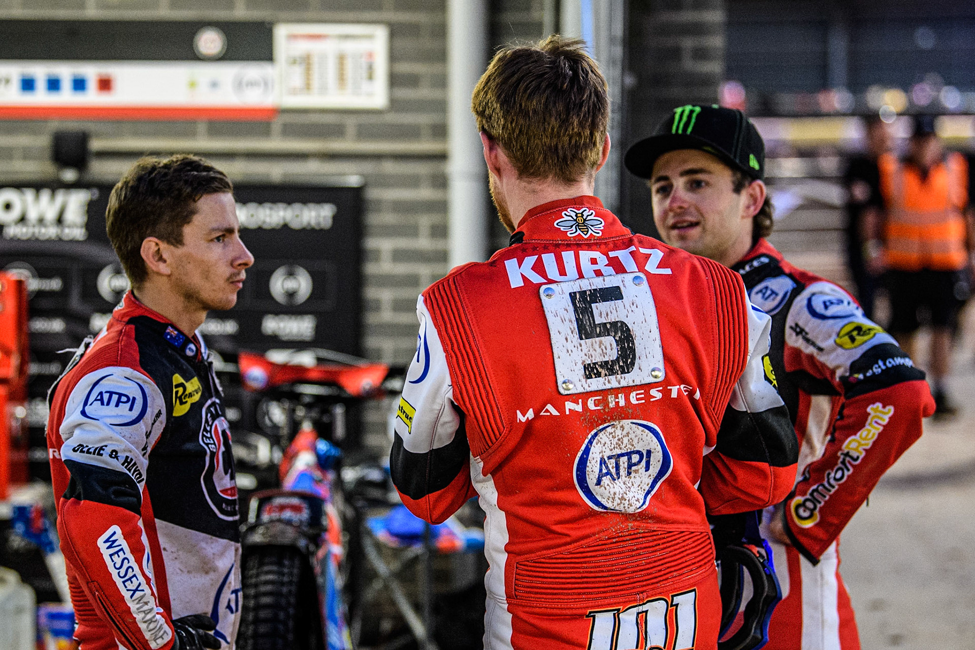 Belle Vue Aces' Brady Kurtz  (back to camera) chats with Belle Vue Aces' Ben Cook  (Left) and Belle Vue Aces' Jaimon Lidsey  (Right) during the Rowe Motor Oil Premiership match between Belle Vue Aces and King's Lynn Stars at the National Speedway Stadium, Manchester on Monday 12th August 2024. (Photo: Ian Charles | MI News)