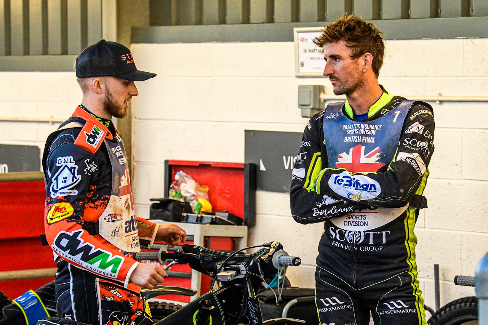 Ipswich team mates Jordan Jenkins (Left) and Adam Ellis chat at the interval during the Attis Insurance Sports Division British Speedway Championship Final at the National Speedway Stadium, Manchester on Saturday 8th June 2024. (Photo: Ian Charles | MI News)