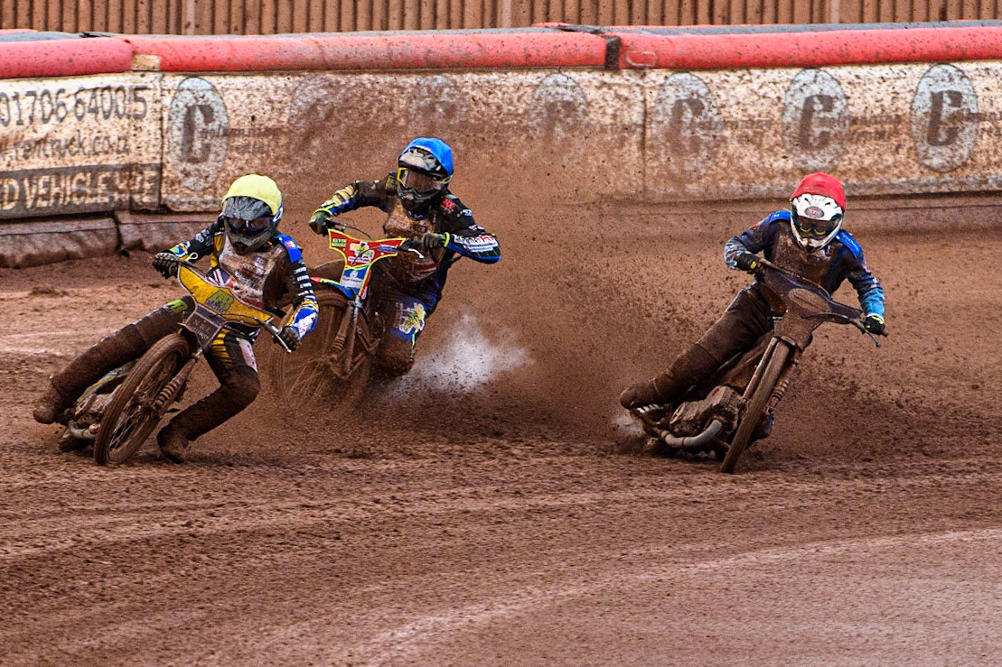 Ben Barker (Yellow) leads as Richard Lawson (Red) and Simon Lambert (Blue) struggle on the heavy track during the Sports Insure British Speedway Final at the National Speedway Stadium, Manchester on Monday 14th August 2023. (Photo: Ian Charles | MI News)