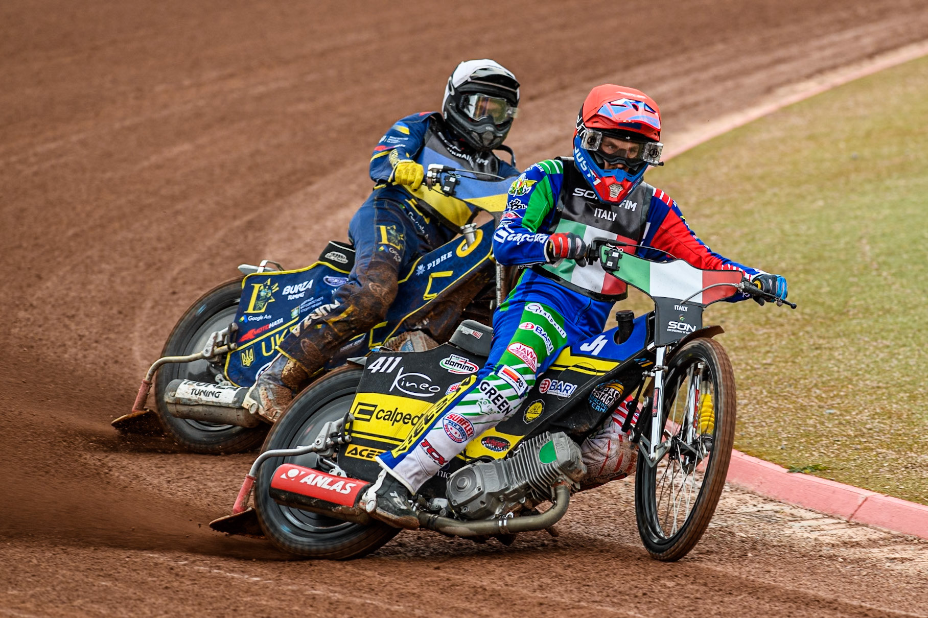 Italy v Ukraine: Paco Castagna of Italy in Red Stanislav Melnychuk of Ukraine in White leading during the Monster Energy FIM Speedway of Nations Semi-Final 1 at the National Speedway Stadium, Manchester on Tuesday 9th July 2024. (Photo: Ian Charles | MI News)