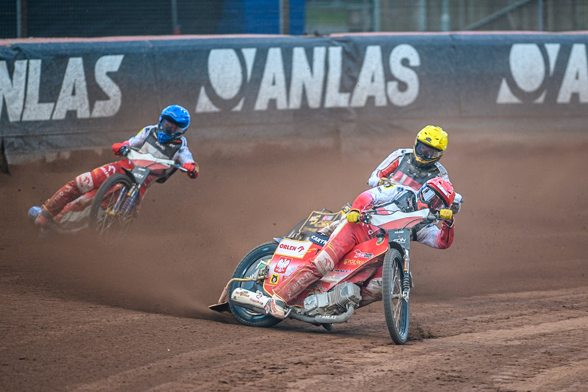 Dominik Kubera of Poland in Red leading Anders Thomsen of Denmark in Yellow and Bartosz Zmarzlik of Poland in Blue during the Monster Energy FIM Speedway of Nation Final at the National Speedway Stadium, Manchester on Saturday 13th July 2024. (Photo: Ian Charles | MI News)