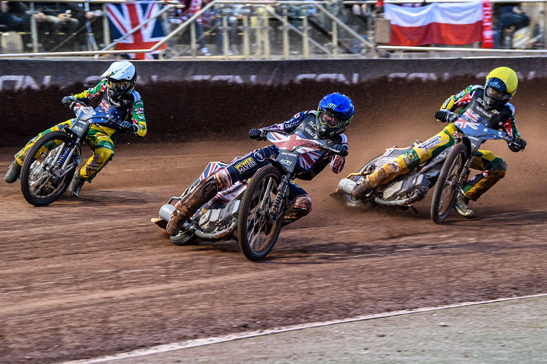 Dan Bewley of Great Britain in Blue leading Jack Holder of Australia in White and Brady Kurtz of Australia in Yellowduring the Monster Energy FIM Speedway of Nation Final at the National Speedway Stadium, Manchester on Saturday 13th July 2024. (Photo: Ian Charles | MI News)