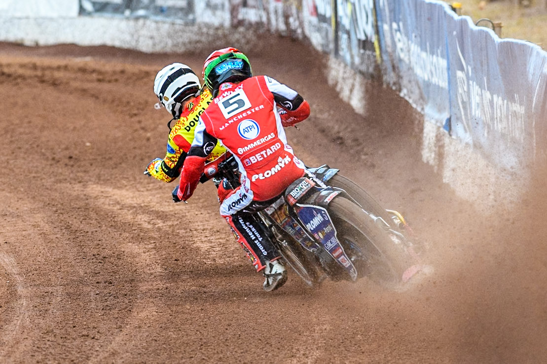 Belle Vue Aces' Dan Bewley in Red chases Leicester Lions' Ryan Douglas in White during the Rowe Motor Oil Premiership match between Belle Vue Aces and Leicester Lions at the National Speedway Stadium, Manchester on Monday 24th June 2024. (Photo: Ian Charles | MI News)