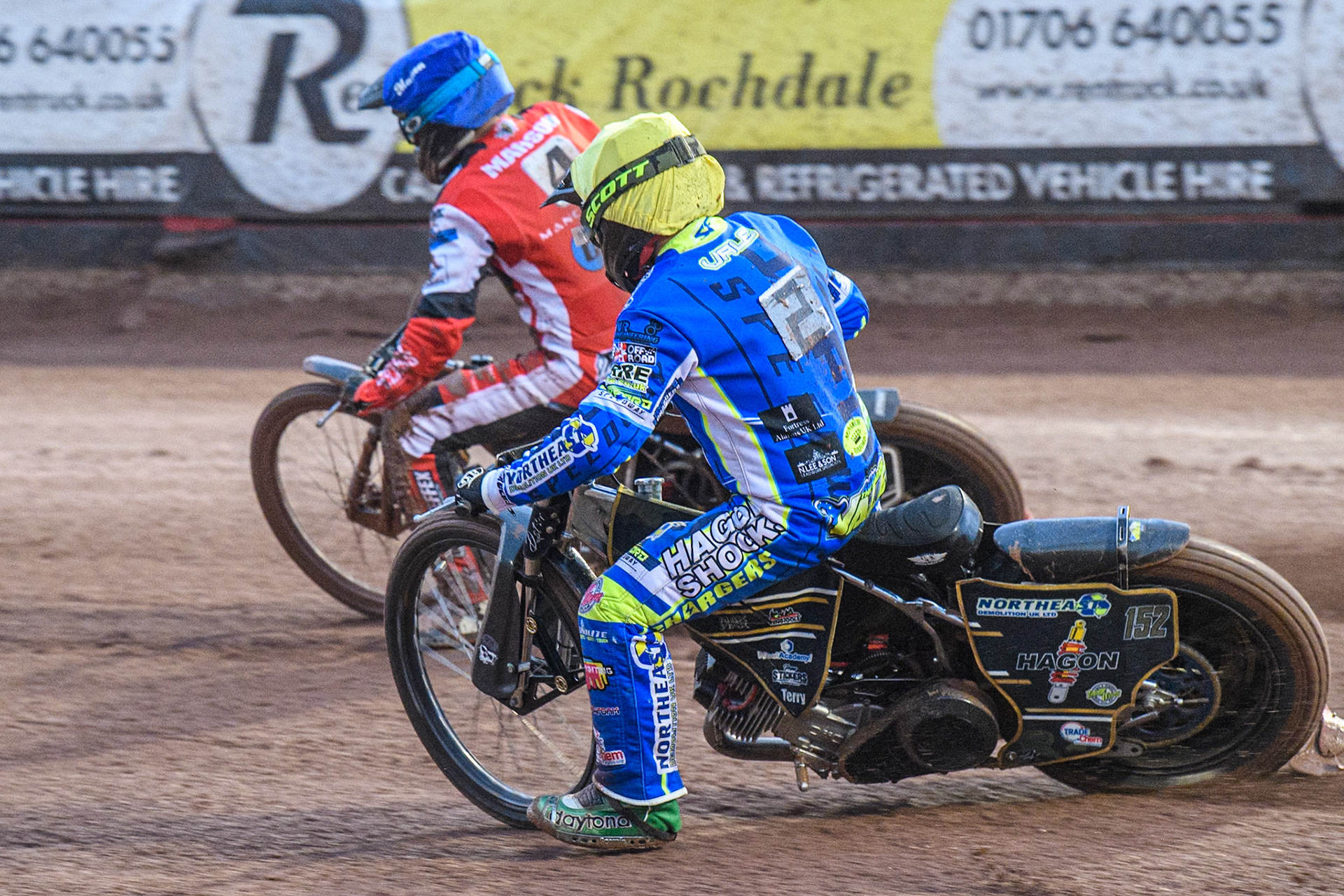 Oxford Chargers' Ashton Vale  in Yellow chases Belle Vue Colts' Matt Marson  in Blue during the WSRA National Development League match between Belle Vue Colts and Oxford Chargers at the National Speedway Stadium, Manchester on Friday 2nd August 2024. (Photo: Ian Charles | MI News)