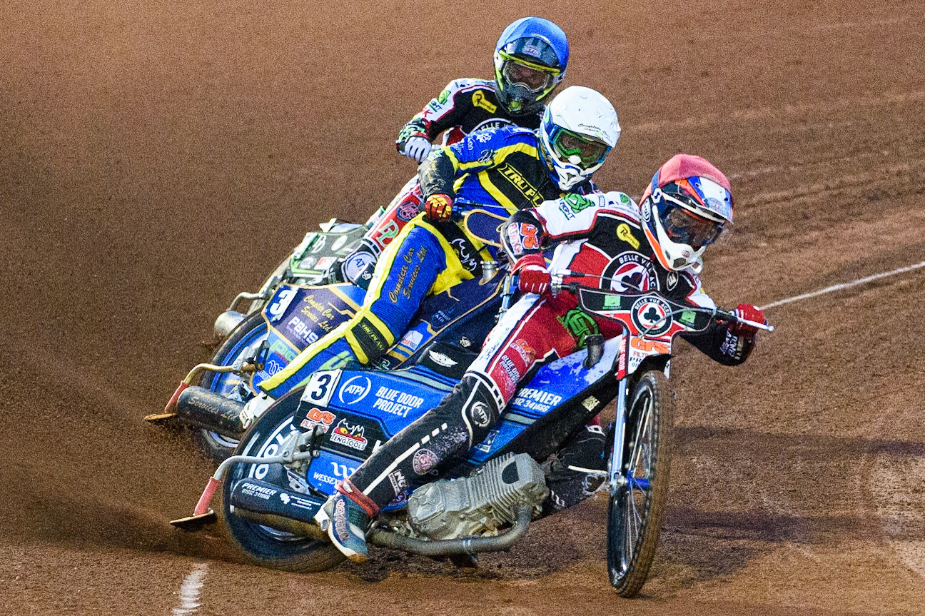 MANCHESTER, UK. SEPT 6TH  Steve Worrall  (Red) leads Kyle Howarth  (White) and Charles Wright  (Blue)  during the SGB Premiership match between Belle Vue Aces and Sheffield Tigers at the National Speedway Stadium, Manchester on Monday 6th September 2021. (Credit: Ian Charles | MI News)