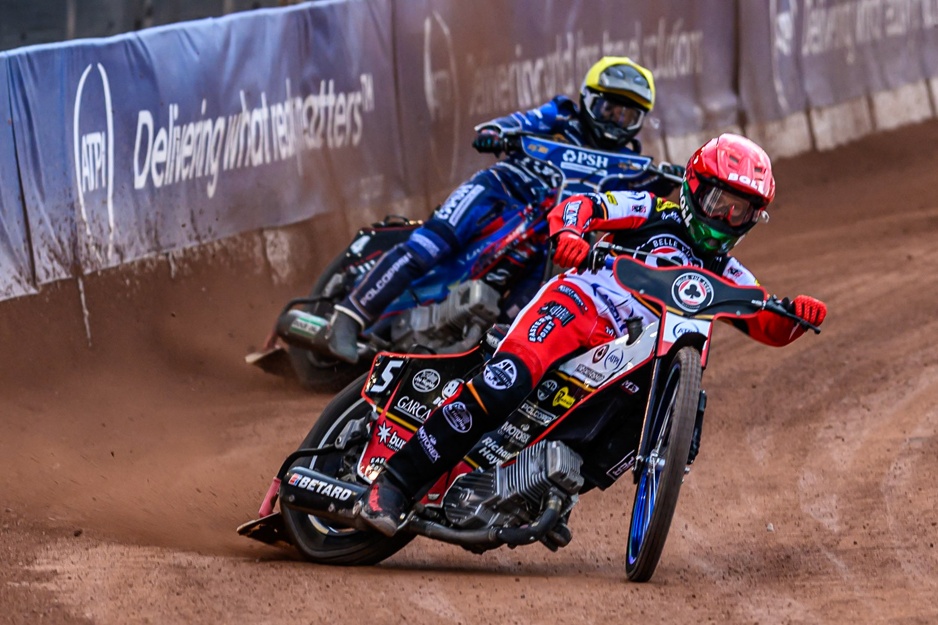 Belle Vue Aces' Brady Kurtz in Red leading Kings Lynn Stars' Ben Cook in Yellow during the Rowe Motor Oil Premiership match between Belle Vue Aces and King's Lynn Stars at the National Speedway Stadium, Manchester on Monday 23rd June 2025. (Photo: Ian Charles | MI News)