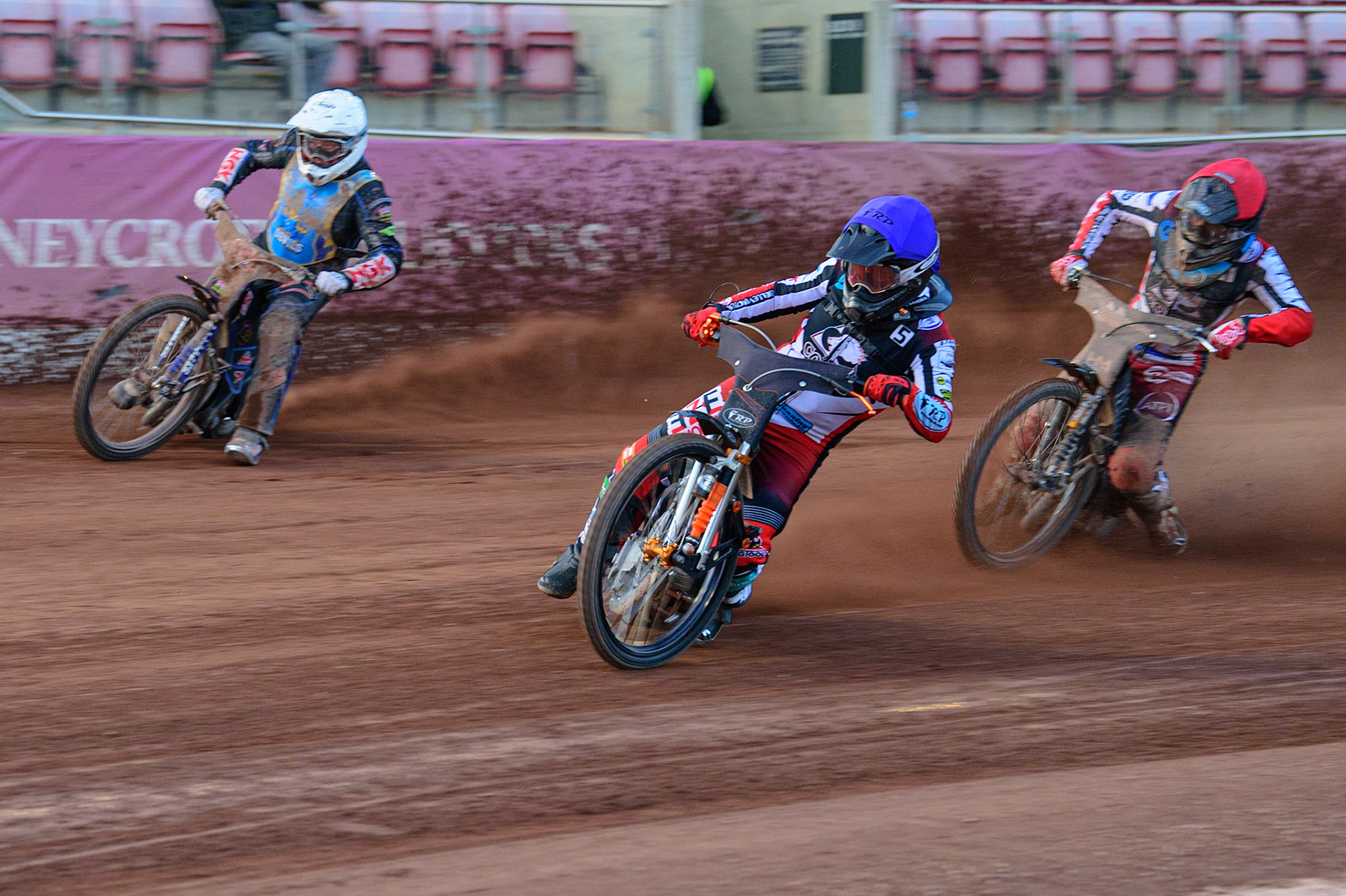 MANCHESTER, UK. MAY 27TH Jack Smith  (Blue) inside Tom Woolley  (White) with Harry McGurk  (Red) behind during the National Development League match between Belle Vue Colts and Armadale Devils at the National Speedway Stadium, Manchester on Friday 27th May 2022. (Credit: Ian Charles | MI News)