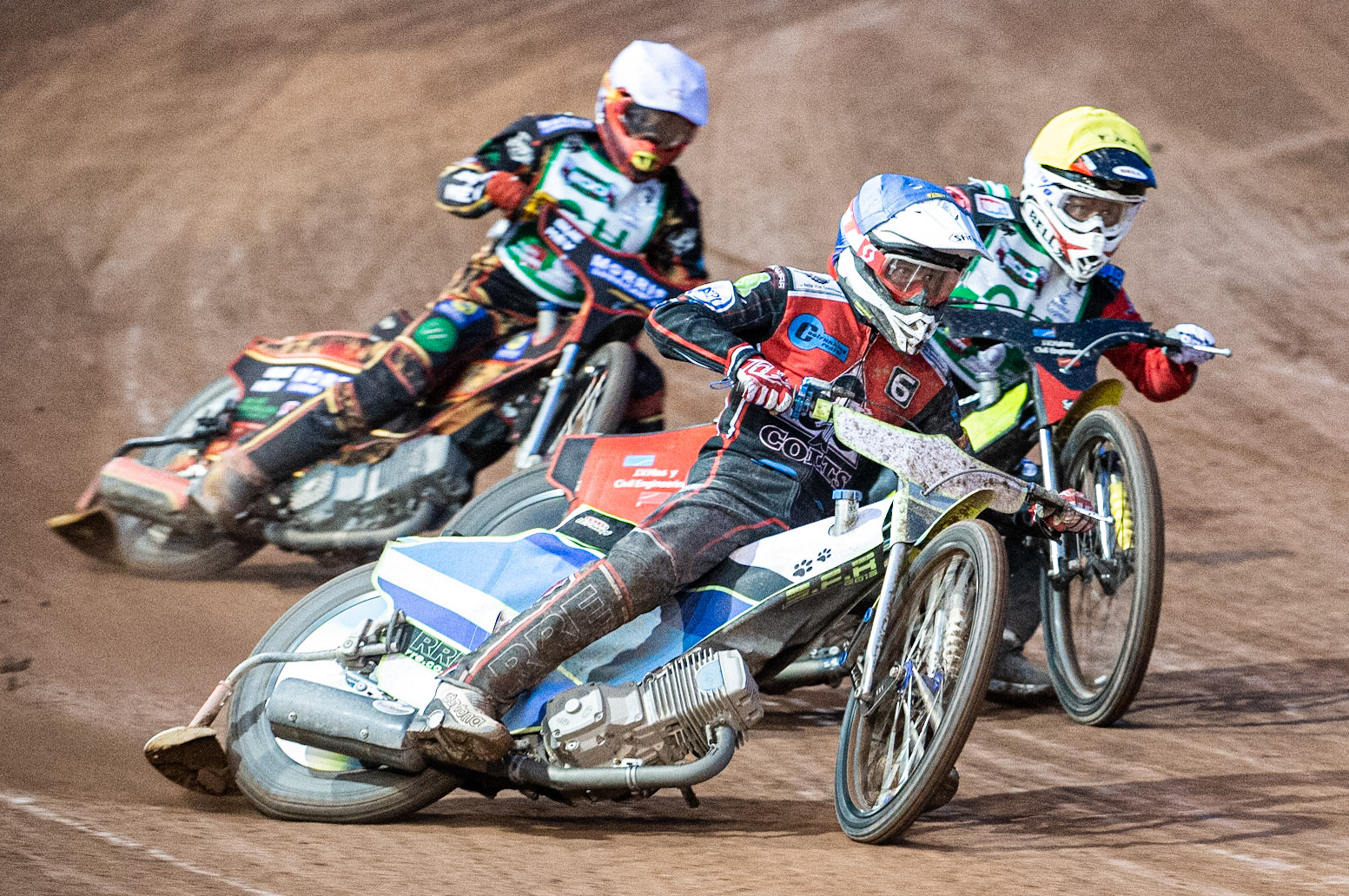 Photo: Ian Charles

Danny Phillips  (Blue) passes Dan Halsey  (Yellow) and Luke Harris  (White)

Belle Vue Colts v Cradley Heathens, SGB National League, Belle Vue National Speedway Stadium, Manchester, Thursday 29  August  2019