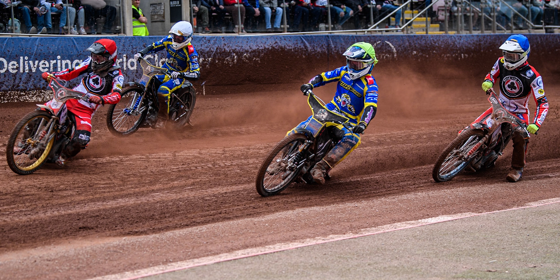 Norick Blödorn of Belle Vue Aces in Red leading Leon Flint of Sheffield Tigers in Yellow, Anders Rowe of Sheffield Tigers in White and Jake Mulford of Belle Vue Aces in Blue during the Rowe Motor Oil Premiership match between Belle Vue Aces and Sheffield Tigers at the National Speedway Stadium, Manchester on Monday 5th May 2025. (Photo: Ian Charles | MI News)