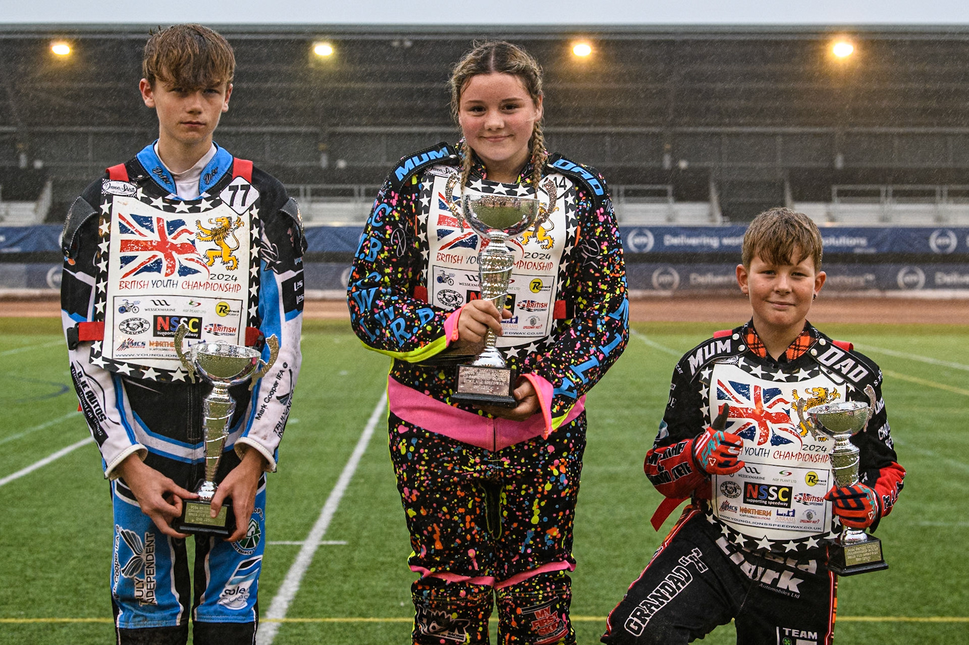 125cc Final Top 3: (L to R) Jack Scully-Syer (2nd), Tia May Brant (Winner) Rhys Harrow (3rd) during the WSRA National Development League match between Belle Vue Colts and Oxford Chargers at the National Speedway Stadium, Manchester on Friday 2nd August 2024. (Photo: Ian Charles | MI News)