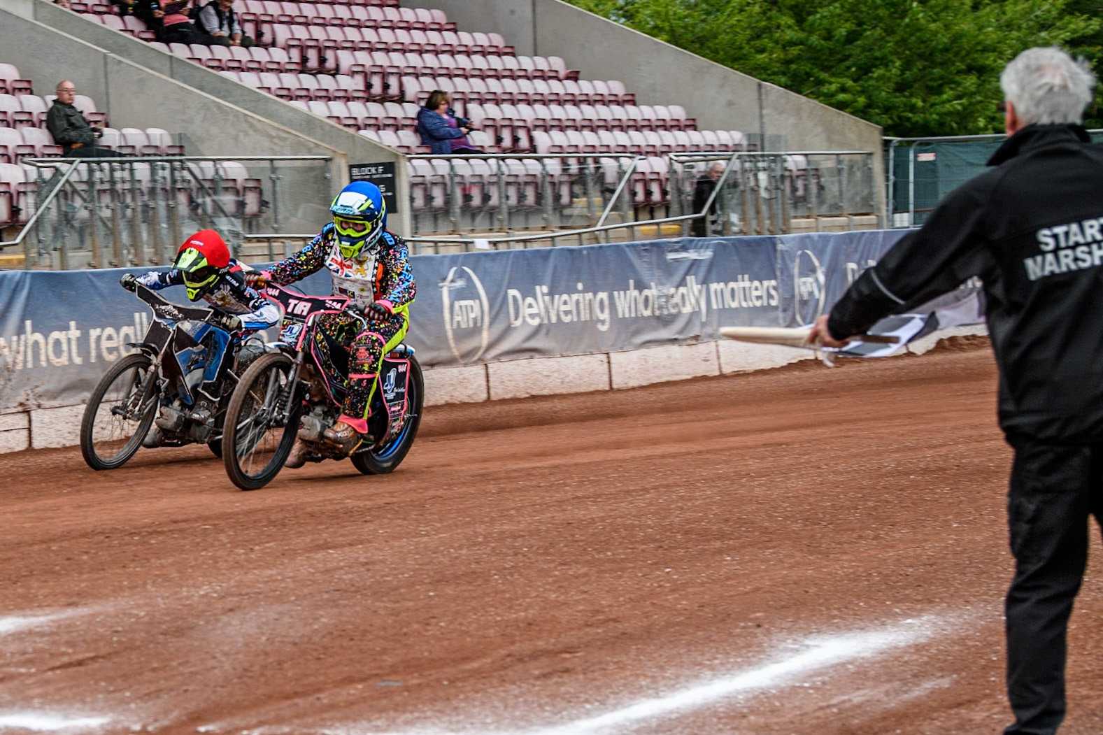Tia May Brant (125cc) in Blue beats Jack Scully-Syer (125cc)  in Red to the finish line during the British Youth 500cc Championships at the National Speedway Stadium, Manchester on Friday 2nd August 2024. (Photo: Ian Charles | MI News)
