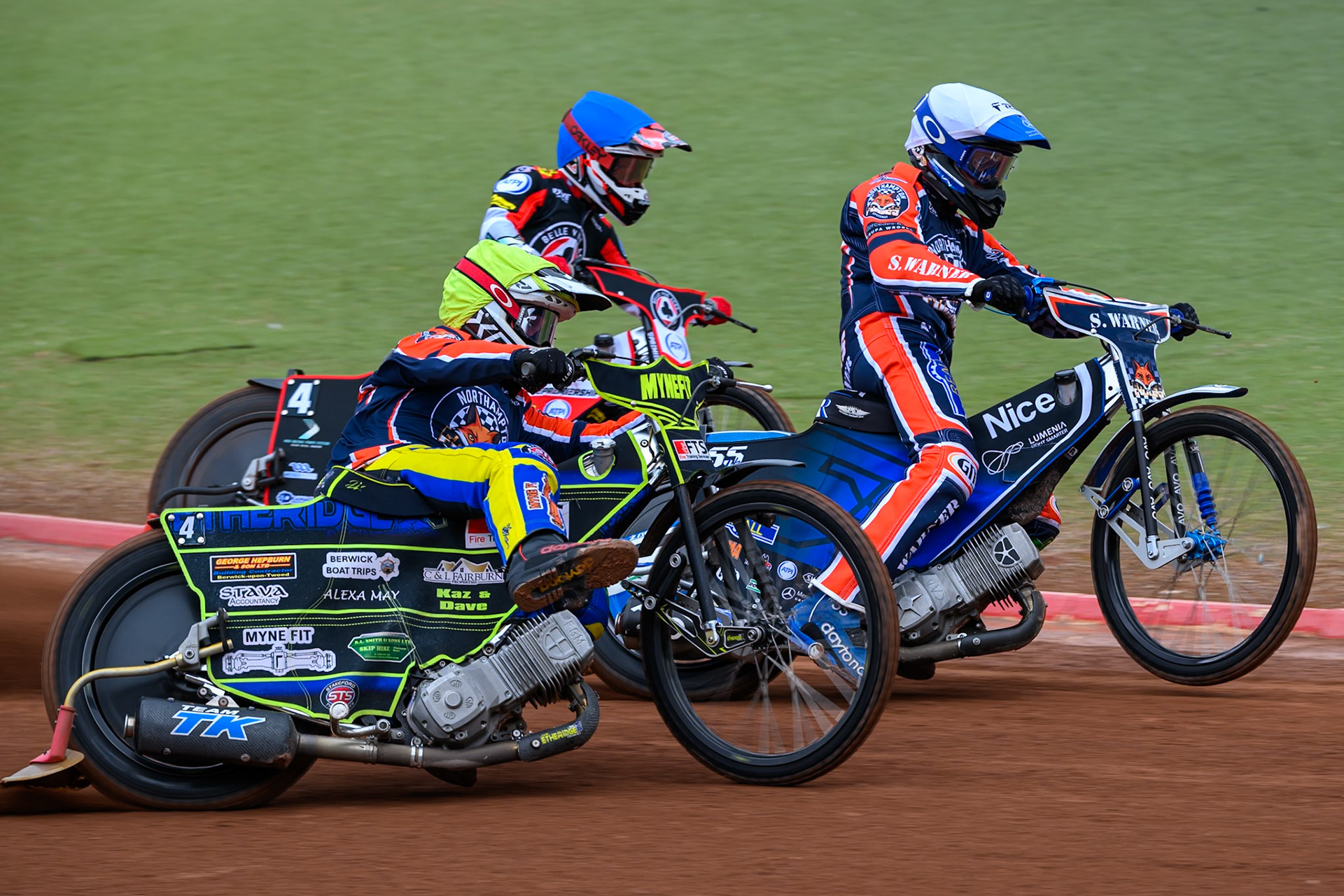 Jye Etheridge, Guest Rider for Northampton Foxes in Yellow rides outside Matej Zagar of Northampton Foxes in White and Zach Cook of Belle Vue Aces in Blue during the Rowe Motor Oil Premiership match between Belle Vue Aces and Northampton Foxes at the National Speedway Stadium, Manchester on Monday 4th May 2026. (Photo: Ian Charles | MI News)