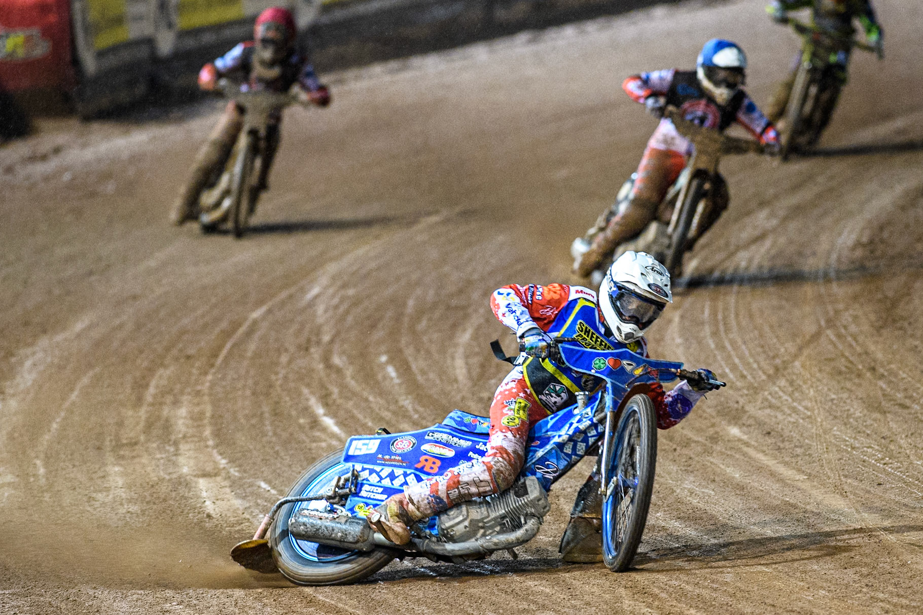 Sheffield Cubs' Stene Pijper  in White leading Belle Vue Colts' Chad Wirtzfeld in Blue and Belle Vue Colts' Freddy Hodder in Red during the WSRA National Development League match between Belle Vue Colts and Sheffield Tiger Cubs at the National Speedway Stadium, Manchester on Monday 7th October 2024. (Photo: Ian Charles | MI News)