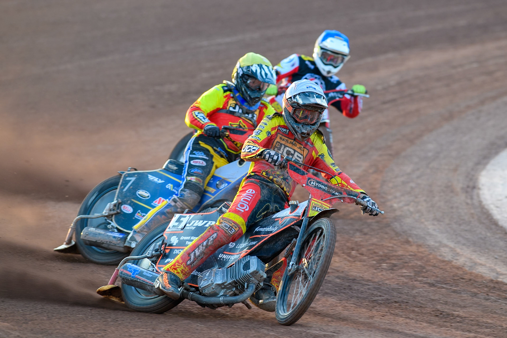 Leicester Lions' Sam Masters in White leading Leicester Lions' Joe Thompson in Yellow and Belle Vue Aces' Jake Mulford in Blue during the Rowe Motor Oil Premiership match between Belle Vue Aces and Leicester Lions at the National Speedway Stadium, Manchester on Monday 19th May 2025. (Photo: Ian Charles | MI News)