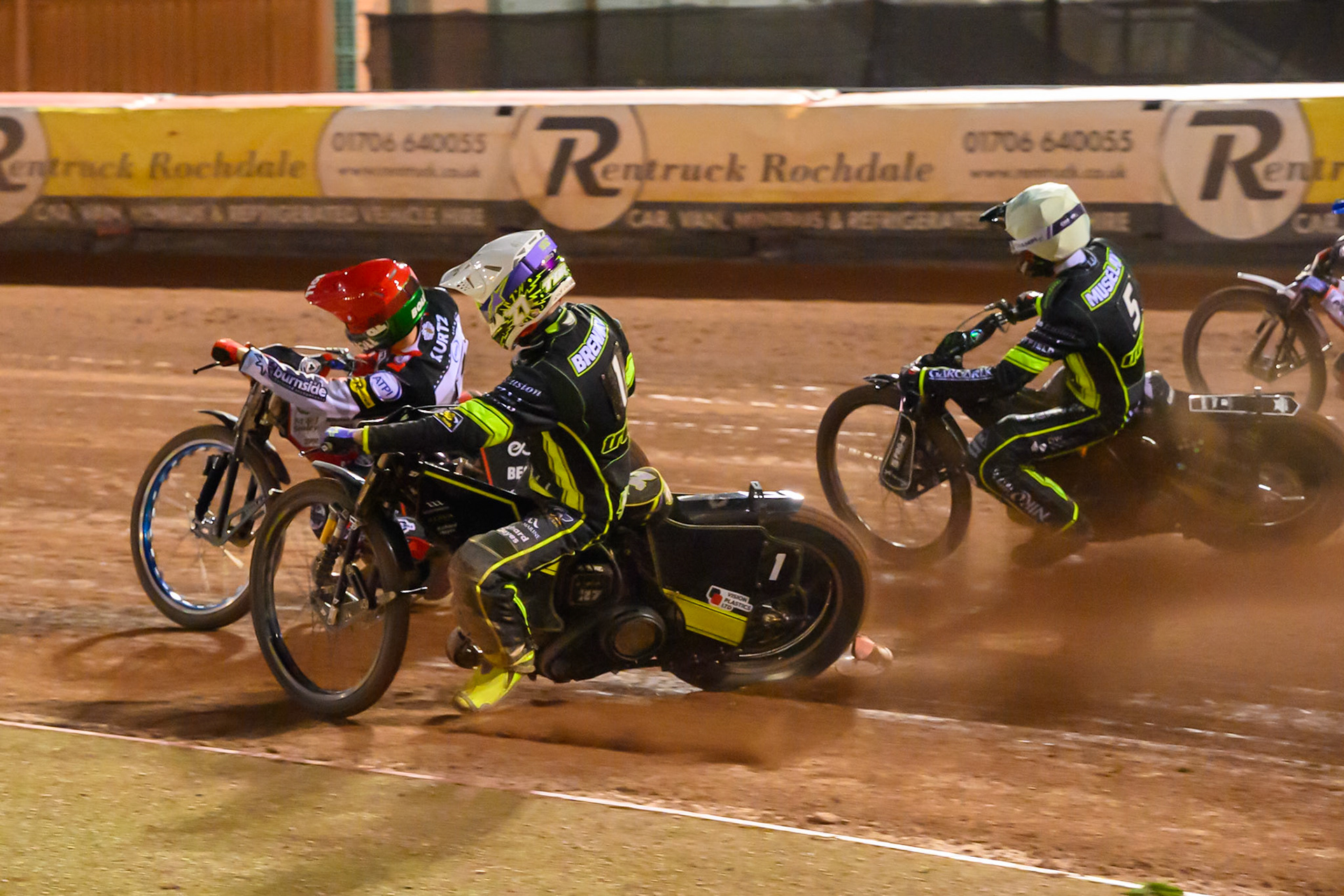Tom Brennan of Ipswich Witches  in White and Tobiasz Musielak of Ipswich Witches  in Yellow chases Brady Kurtz of Belle Vue Aces  in Red during the Rowe Motor Oil Premiership match between Belle Vue Aces and Ipswich Witches at the National Speedway Stadium, Manchester on Monday 20th April 2026. (Photo: Ian Charles | MI News)
