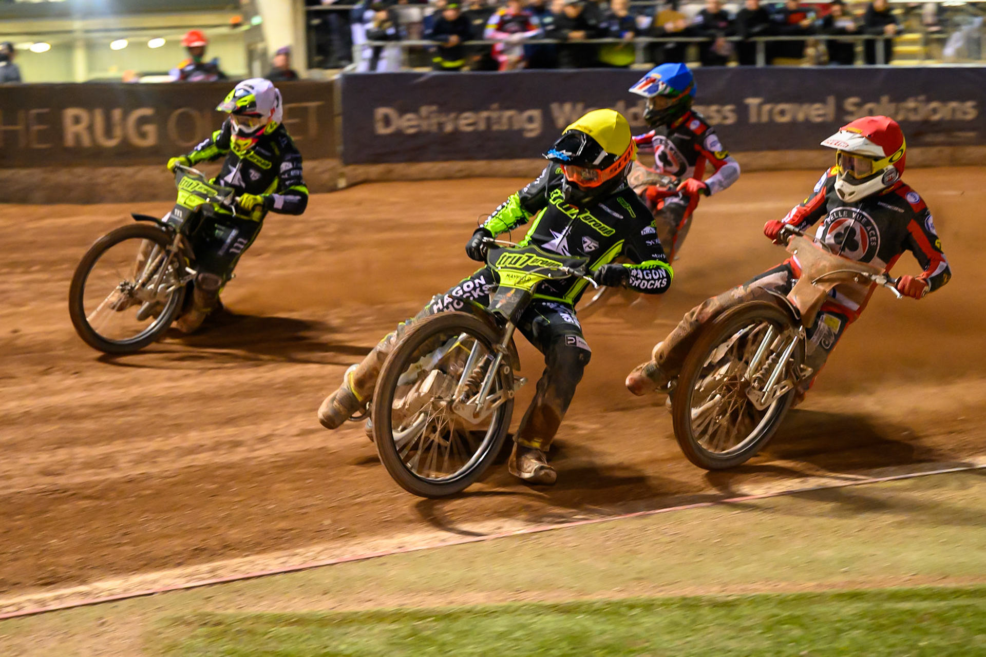 Jason Edwards of Ipswich Witches  in Yellow rides inside team mate Richard Lawson of Ipswich Witches  in White with Peter Kildemand of Belle Vue Aces  in Red and Will Cairns of Belle Vue Aces  in Blue behind during the Rowe Motor Oil Premiership match between Belle Vue Aces and Ipswich Witches at the National Speedway Stadium, Manchester on Monday 20th April 2026. (Photo: Ian Charles | MI News)