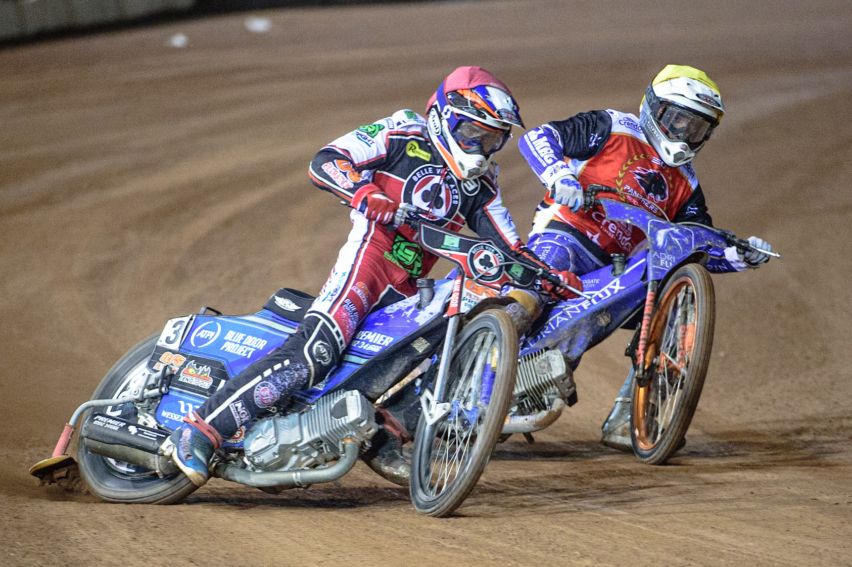 MANCHESTER, UK. OCT 11TH  Steve Worrall   (Red) passes Lewis Kerr  (Yellow) during the SGB Premiership Grand Final 1st Leg between Belle Vue Aces and Peterborough Panthers at the National Speedway Stadium, Manchester on Monday 11th October 2021. (Credit: Ian Charles | MI News)