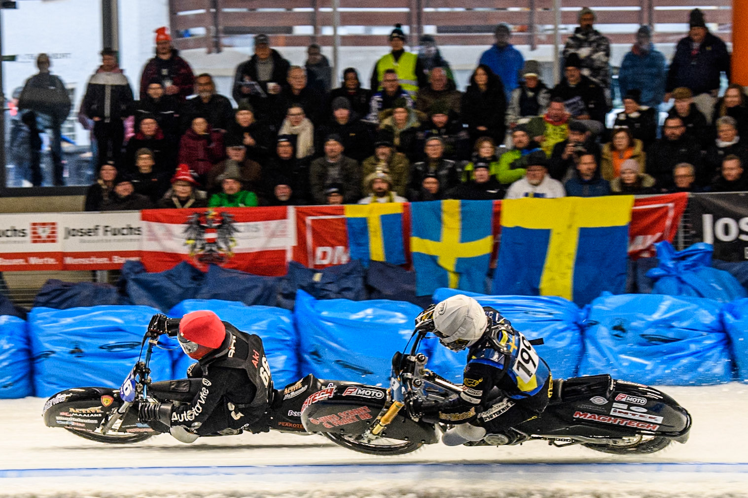 Martin Haarahiltunen (199) of Sweden in White rides inside Aki Ala-Riihimäki (66) of Finland in Red during the Ice Speedway Gladiators World Championship Final 2 at Max-Aicher-Arena, Inzell on Sunday 16th March 2025. (Photo: Ian Charles | MI News)