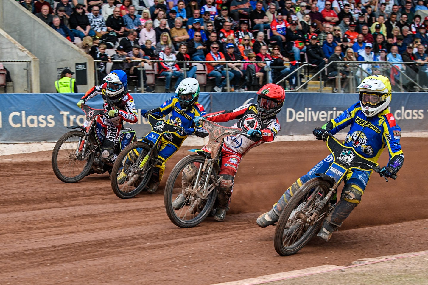 Sheffield Tigers' Josh Pickering in Yellow rides inside Belle Vue Aces' Jaimon Lidsey  in Red Sheffield Tigers' Chris Holder  in White and Belle Vue Aces' Jake Mulford in White during the Rowe Motor Oil Premiership match between Belle Vue Aces and Sheffield Tigers at the National Speedway Stadium, Manchester on Monday 26th August 2024. (Photo: Ian Charles | MI News)