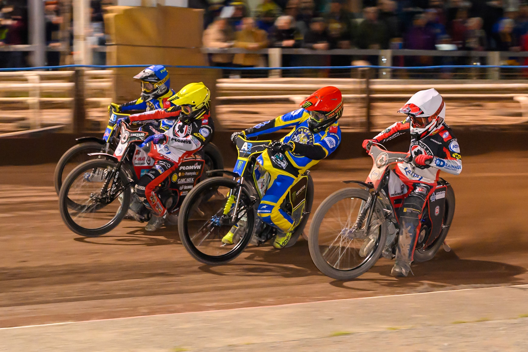 Zach Cook of Belle Vue Aces  in White rides inside Chris Holder of Sheffield Tigers  in Red, Dan Bewley of Belle Vue Aces in Yellow, and Josh Pickering of Sheffield Tigers   in Blue during the Knockout Cup Northern Section match between Sheffield Tigers and Belle Vue Aces at Owlerton Stadium, Sheffield on Thursday 2nd April 2026. (Photo: Ian Charles | MI News)