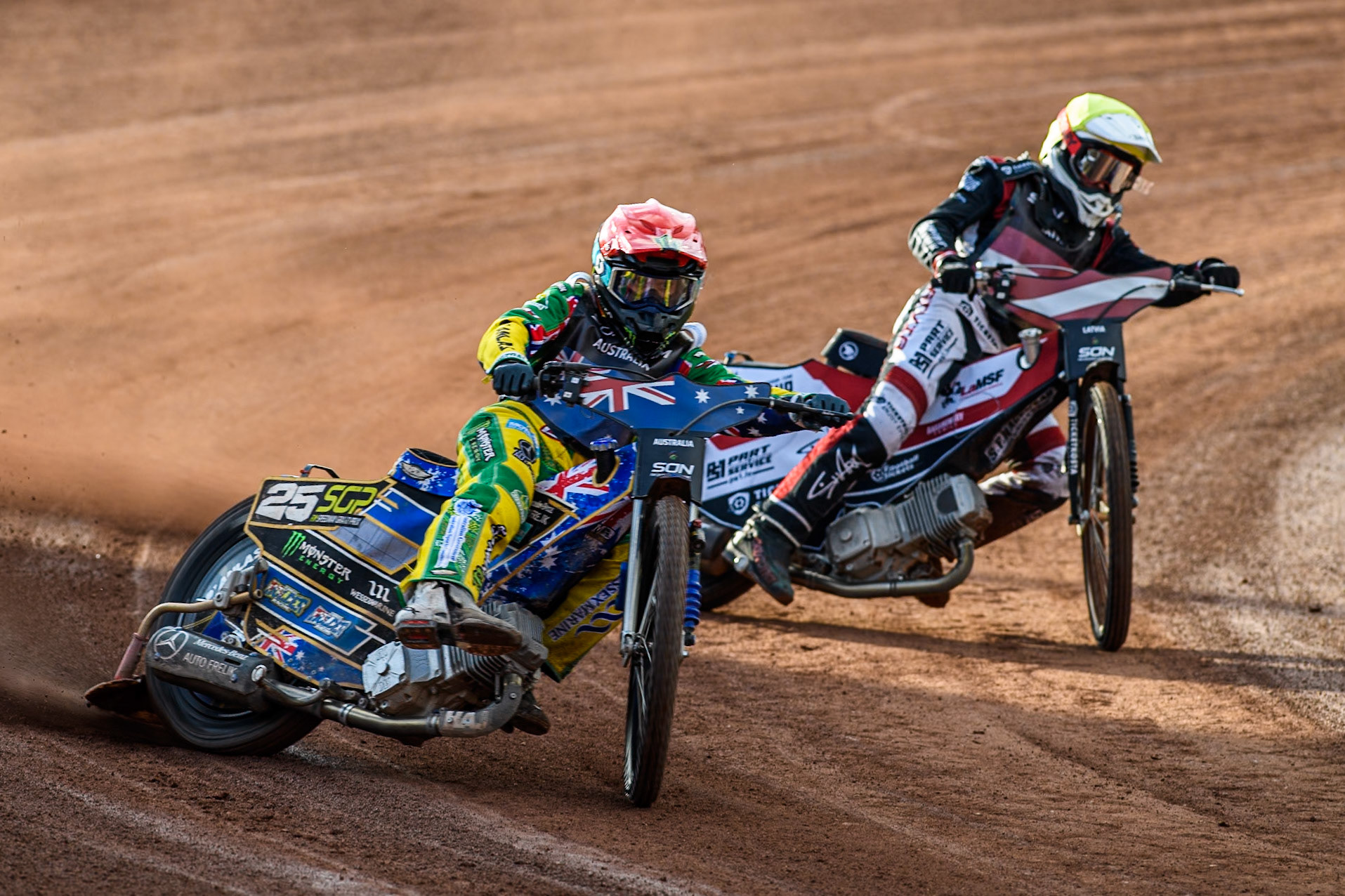 AUSTRALIA v LATVIA: Jack Holder of Australia in Red leading Daniils Kolodinskis of Latvia in Yellow during the Monster Energy FIM Speedway of Nation Final at the National Speedway Stadium, Manchester on Saturday 13th July 2024. (Photo: Ian Charles | MI News)
