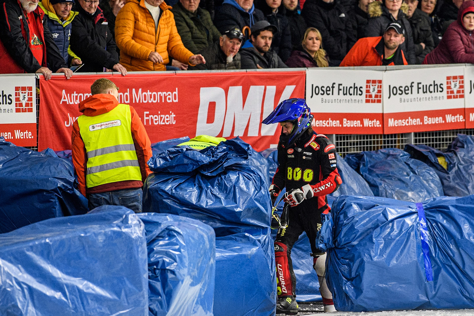 Netherlands' Jasper Iwema (800) climbs out of the straw bales after his fall during the FIM Ice Speedway Gladiators World Championship Final 1 at the Max-Aicher-Arena, Inzell on Saturday 23 March 2024. (Photo: Ian Charles | MI News)