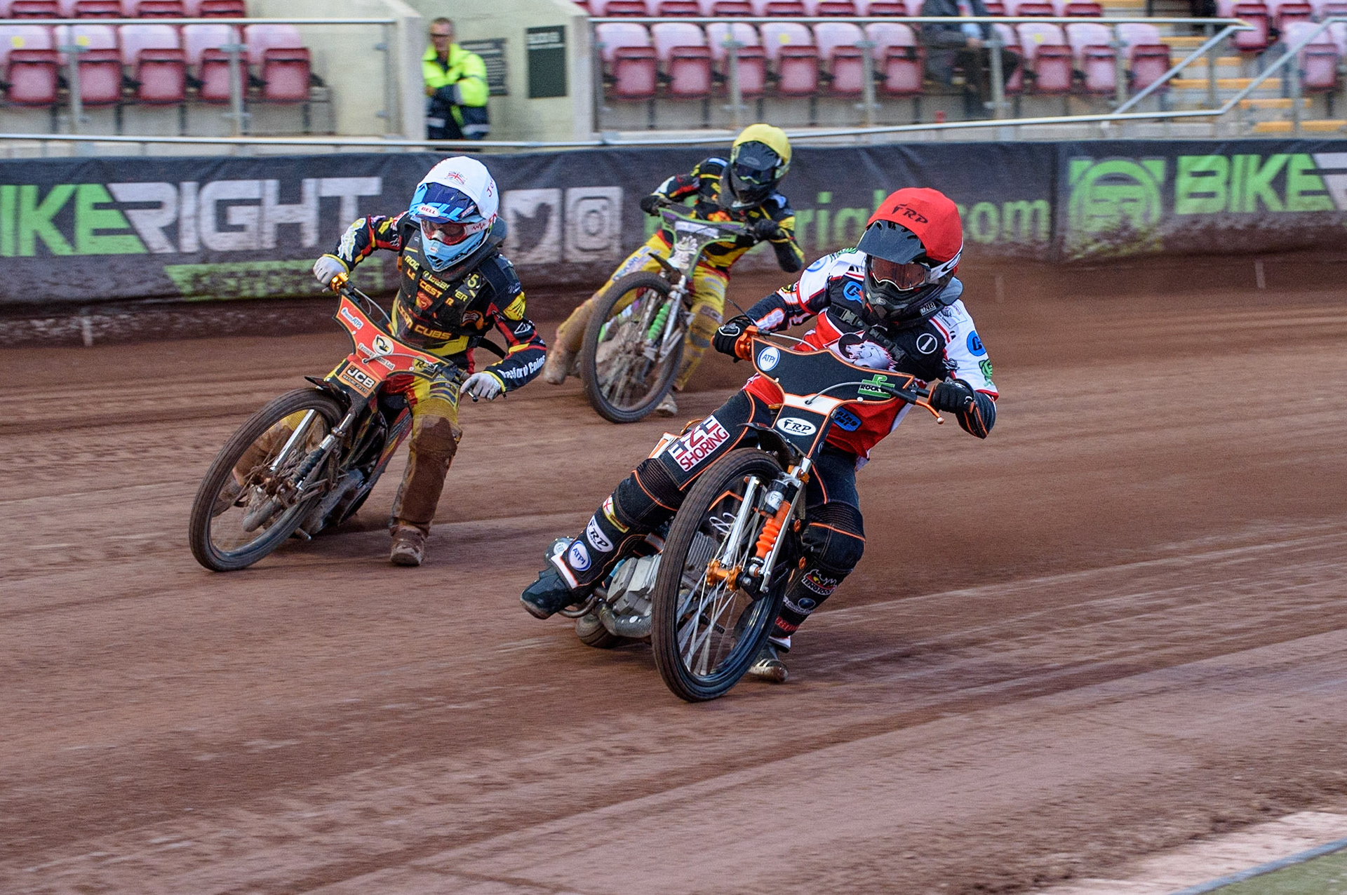 MANCHESTER, UK. JULY 29TH  Jack Smith (Red) inside Joe Thompson  (White) with Kai Ward (Yellow) behind  during the National Development League match between Belle Vue Colts and Leicester Lion Cubs at the National Speedway Stadium, Manchester on Thursday 29th July 2021. (Credit: Ian Charles | MI News)