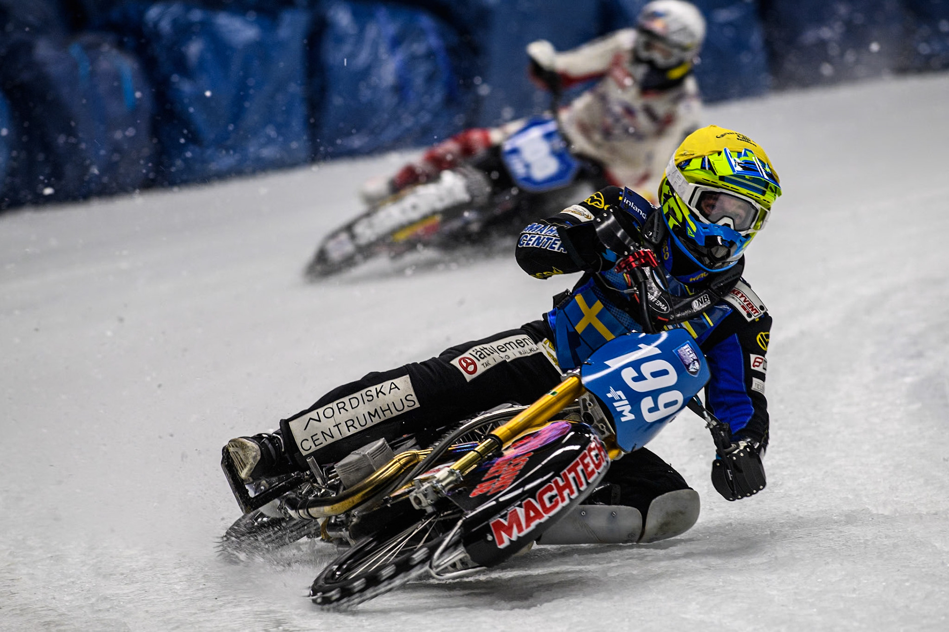 Sweden's Martin Haarahiltunen (199)  (Yellow) leads  Austria's Franz Zorn (100) (White) during the FIM Ice Speedway Gladiators World Championship Final 1 at the Max-Aicher-Arena, Inzell on Saturday 23 March 2024. (Photo: Ian Charles | MI News)