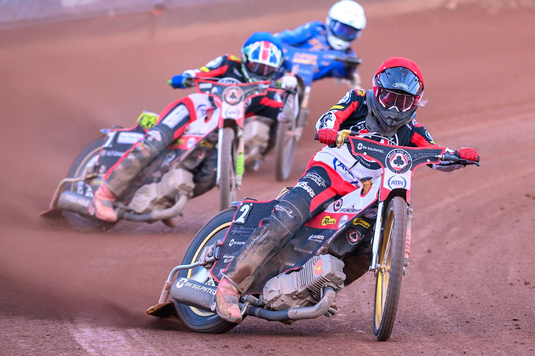 Norick Blödorn of Belle Vue Aces in Red leading William Cairns of Belle Vue Aces in Blue and Cooper Rushen of Kings Lynn Stars in White  during the Rowe Motor Oil Premiership match between Belle Vue Aces and King's Lynn Stars at the National Speedway Stadium, Manchester on Monday 10th August 2026. (Photo: Ian Charles | MI News)