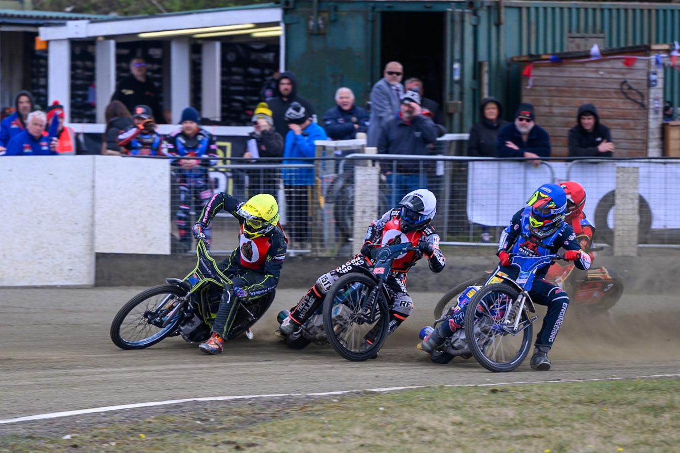 (L to R)Ben Whalley of NDL Nomads  in Yellow, Jack Kingston of NDL Nomads    in White, Jamie Etherington of Buxton Bulls  in Blue with Luke Harris of Buxton Bulls   in Red behind during the  Challenge match between Buxton Bulls and NDL Nomads at Hi-Edge Speedway, Buxton on Sunday 19th April 2026. (Photo: Ian Charles | MI News)
