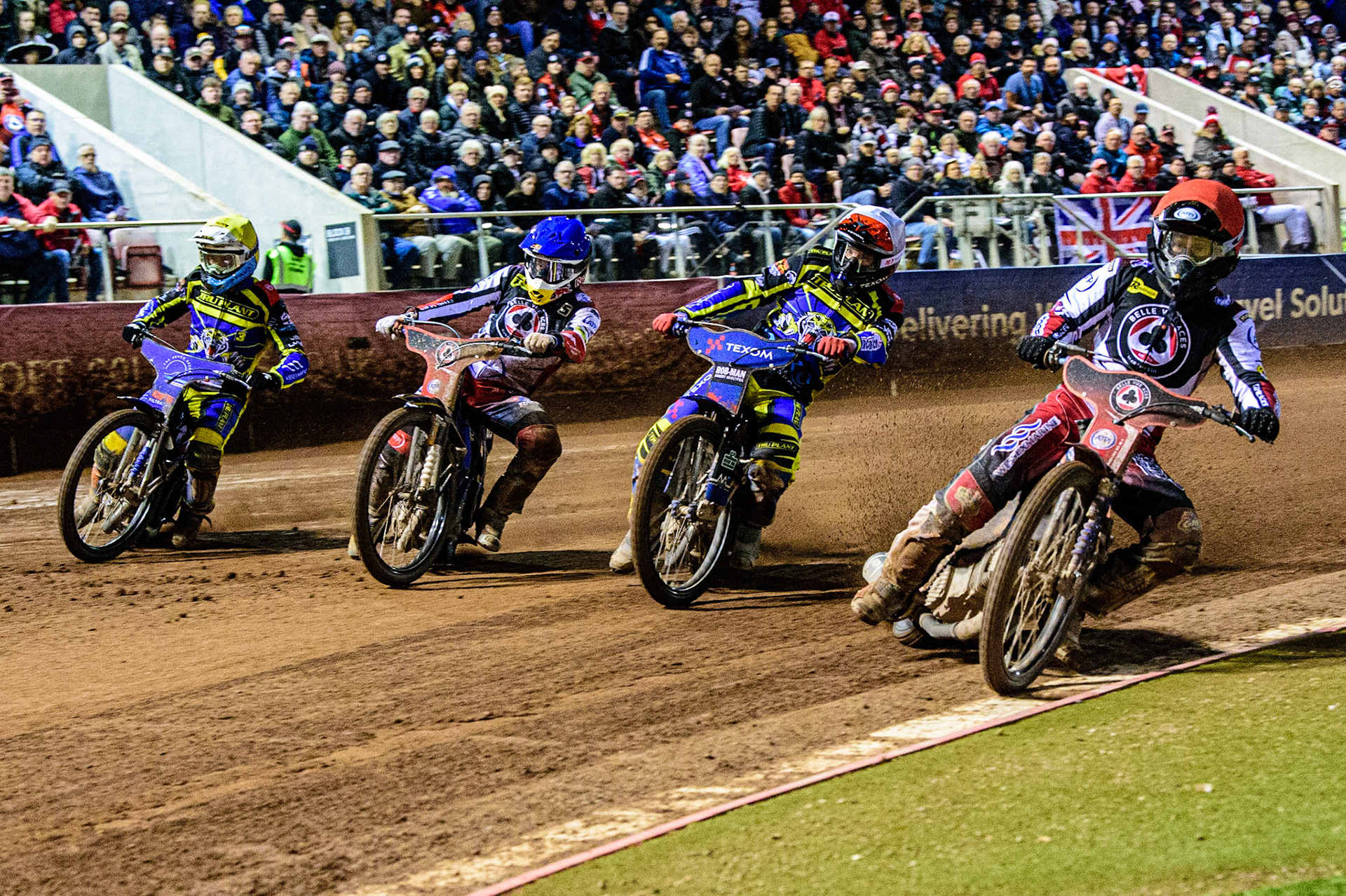 Brady Kurtz  (Red) inside Tobiasz Musielak  (White), Robert Lambert  (Blue) and Adam Ellis  (Yellow) during the SGB Premiership Grand Final 1st leg between Belle Vue Aces and Sheffield Tigers at the National Speedway Stadium, Manchester on Monday 10th October 2022. (Credit: Ian Charles | MI News)