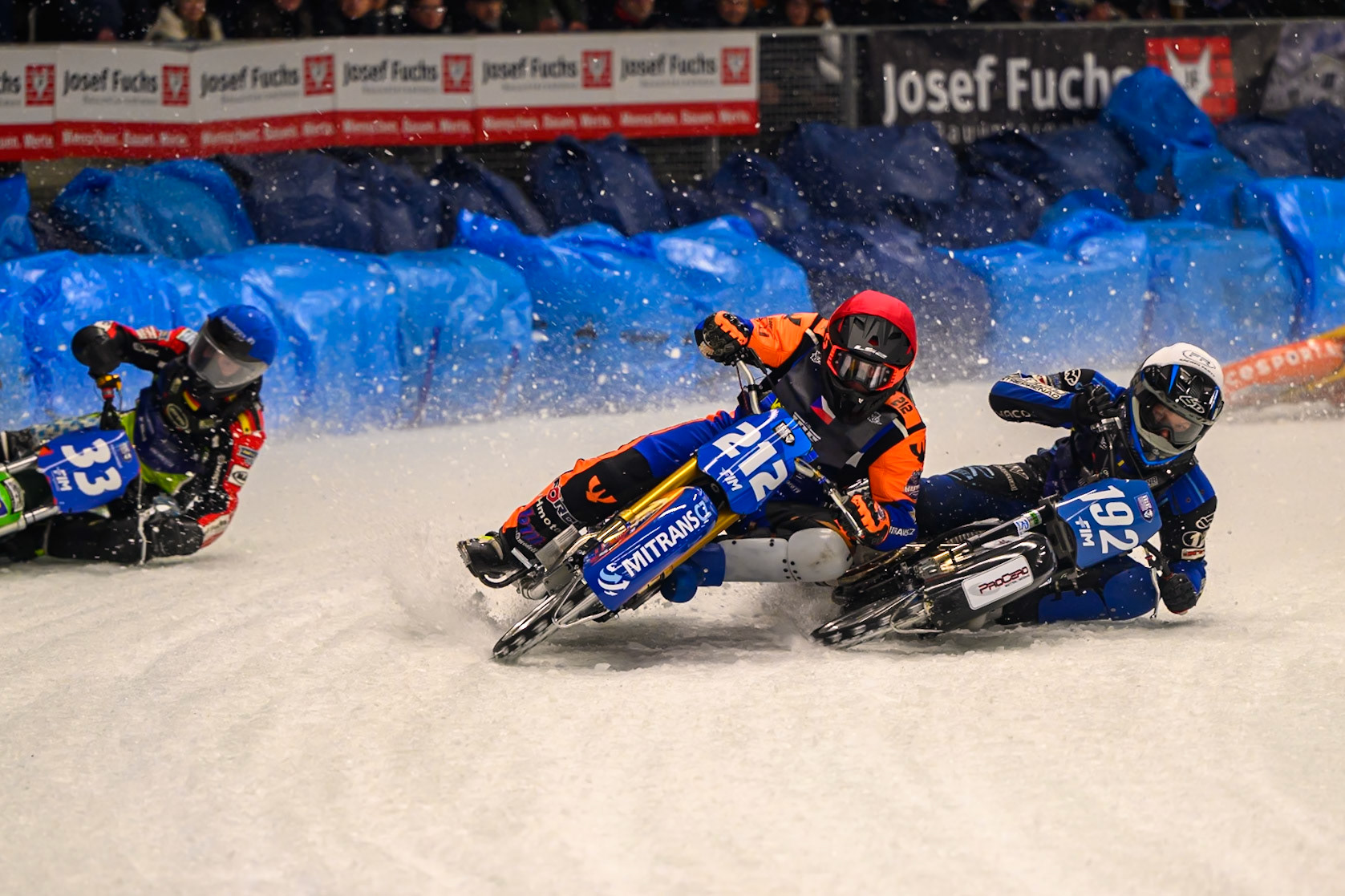 Niclas Svensson (192) of Sweden  in White shoves Lukas Hutla (212) of Czechia in Red out to pass him with Johann Weber (33) of Germany  in Blue on the outside during the Ice Speedway Gladiators World Championship Final 1 at Max-Aicher-Arena, Inzell on Saturday 14th March 2026. (Photo: Ian Charles | MI News)