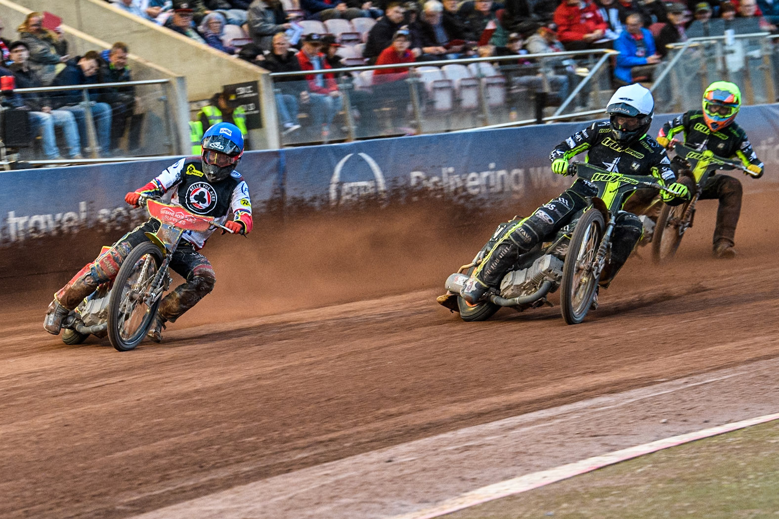 Belle Vue Aces' Tate Zischke  in Blue leading Ipswich Witches' Adam Ellis in White and Ipswich Witches' Keynan Rew in Yellow during the Rowe Motor Oil Premiership match between Belle Vue Aces and Ipswich Witches at the National Speedway Stadium, Manchester on Monday 1st July 2024. (Photo: Ian Charles | MI News)