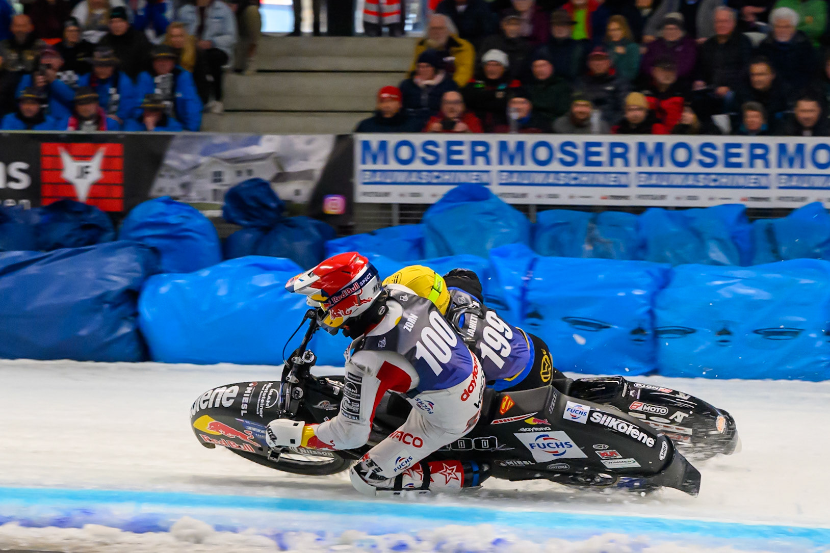 Franz Zorn (100) of Austria in Red rides inside Martin Haarahiltunen (199) of Sweden in Yellow behind during the Ice Speedway Gladiators World Championship Final 2 at Max-Aicher-Arena, Inzell on Sunday 15th March 2026. (Photo: Ian Charles | MI News)