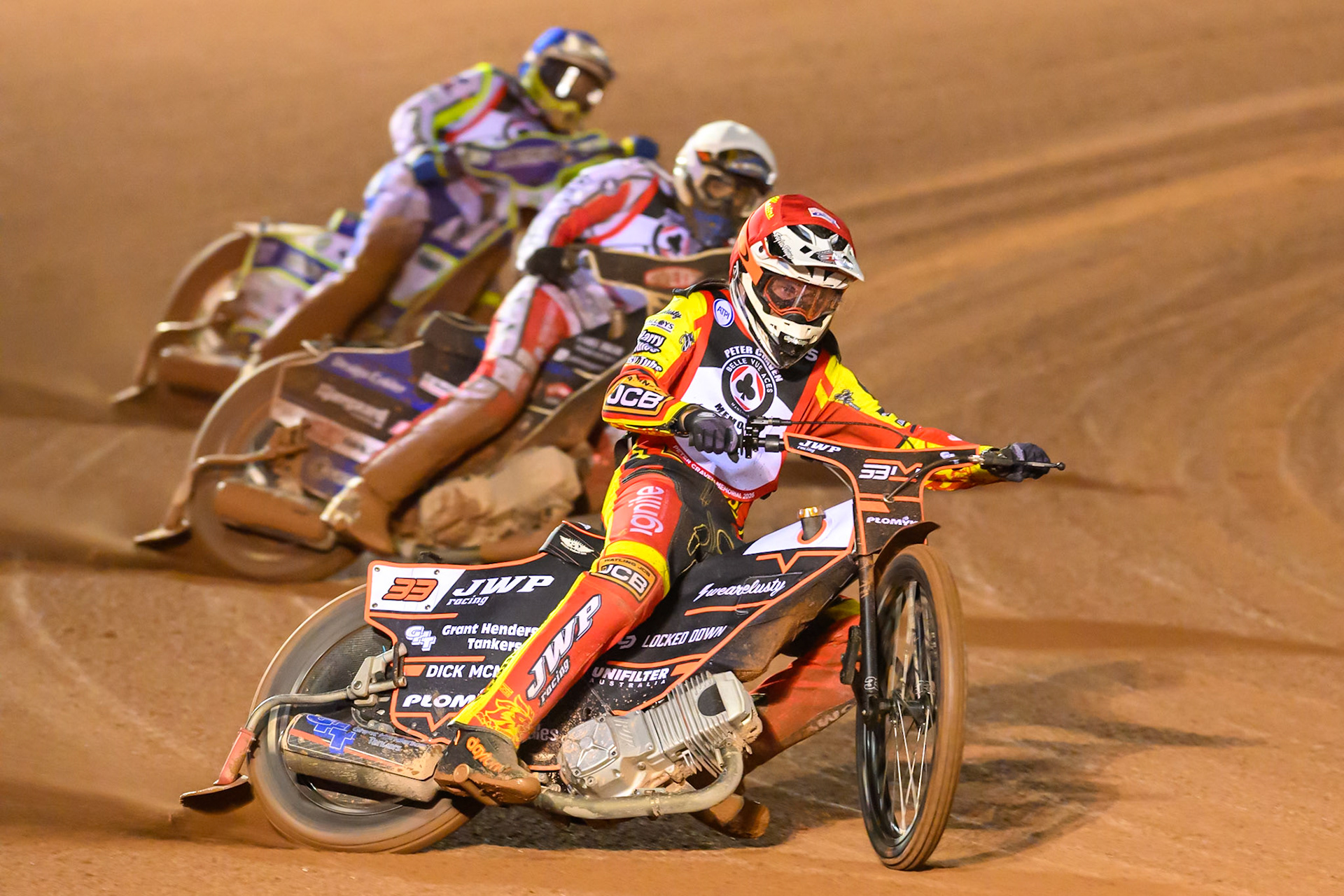 Sam Masters in Red leading Rasmus Jensen  in White and Chris Harris in Blue during the Peter Craven Memorial Trophy at the National Speedway Stadium, Manchester, on Monday 16th March 2026. (Photo: Ian Charles | MI News)