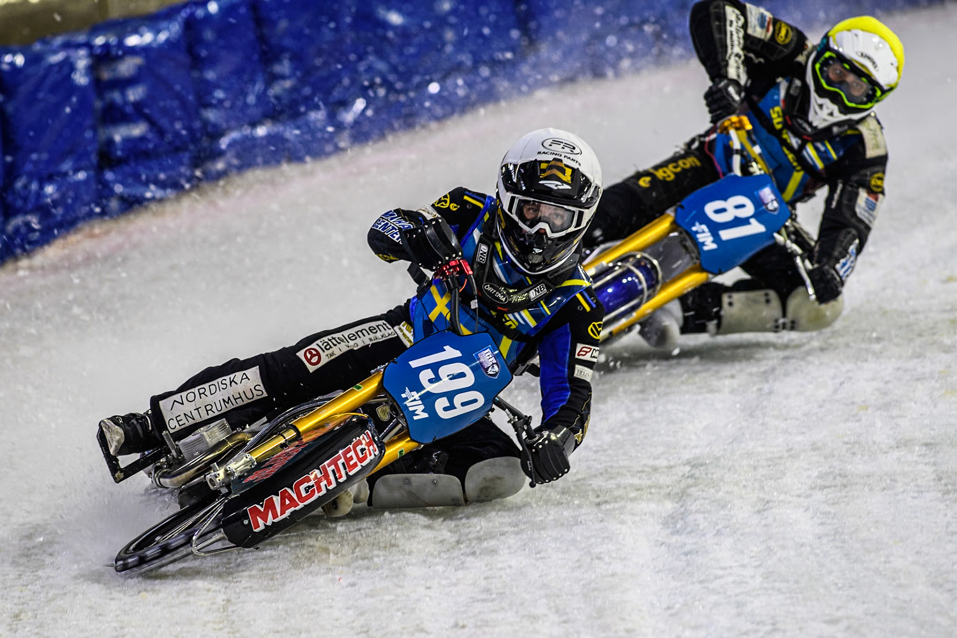 Sweden's Martin Haarahiltunen (199)  in White leading Sweden"s Jimmy Olsén (81) in Yellow during the FIM Ice Speedway Gladiators World Championship Final 3 at Ice Rink Thialf, Heerenveen on Saturday 6th April 2024. (Photo: Ian Charles | MI News)