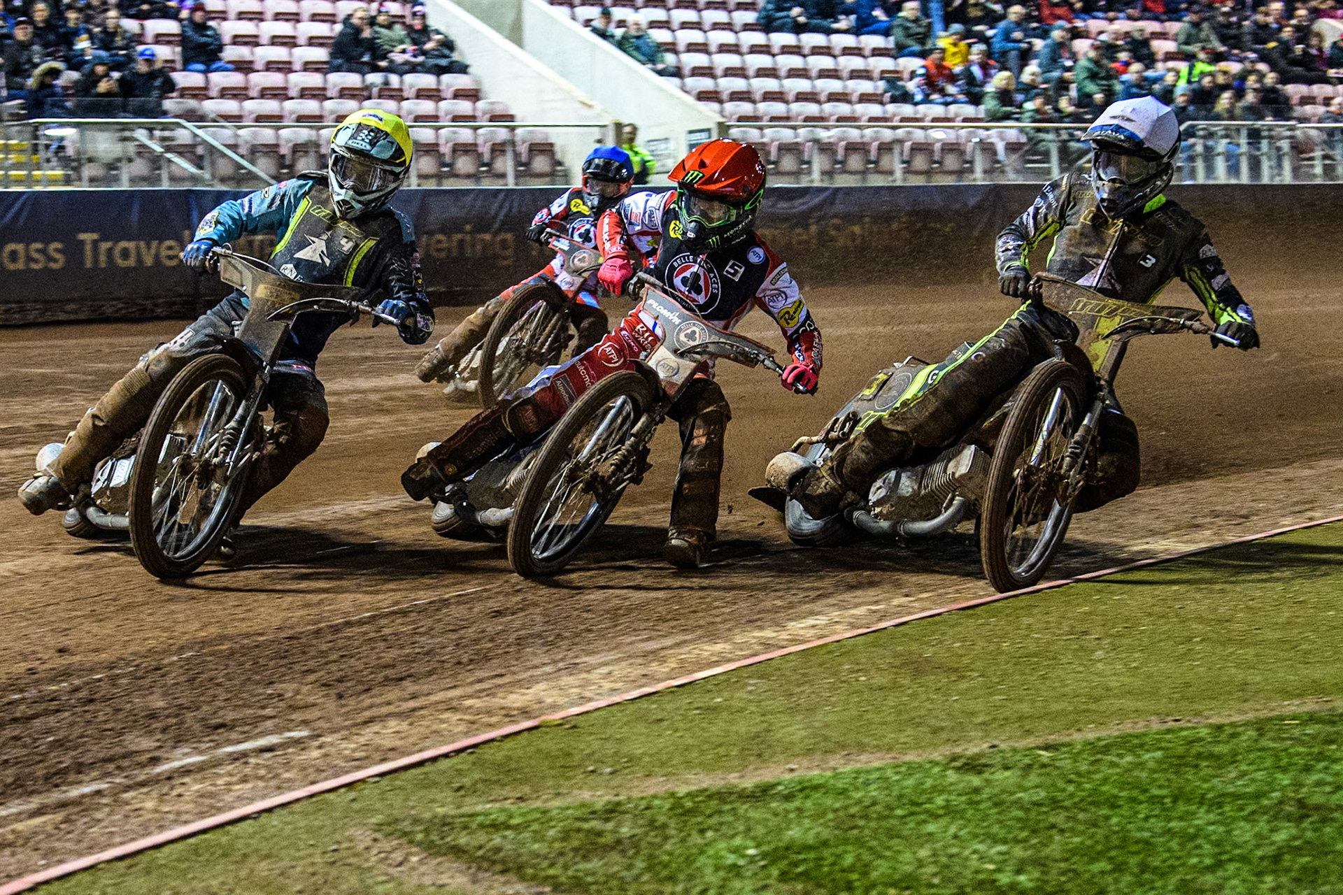 Ipswich Witches' Guest Ryan Douglas in Yellow leading Belle Vue Aces' Dan Bewley in Red and Ipswich Witches' Adam Ellis in White with Belle Vue Aces' Brady Kurtz in Blue behind during the Rowe Motor Oil Premiership match between Belle Vue Aces and Ipswich Witches at the National Speedway Stadium, Manchester on Monday 22nd April 2024. (Photo: Ian Charles | MI News)