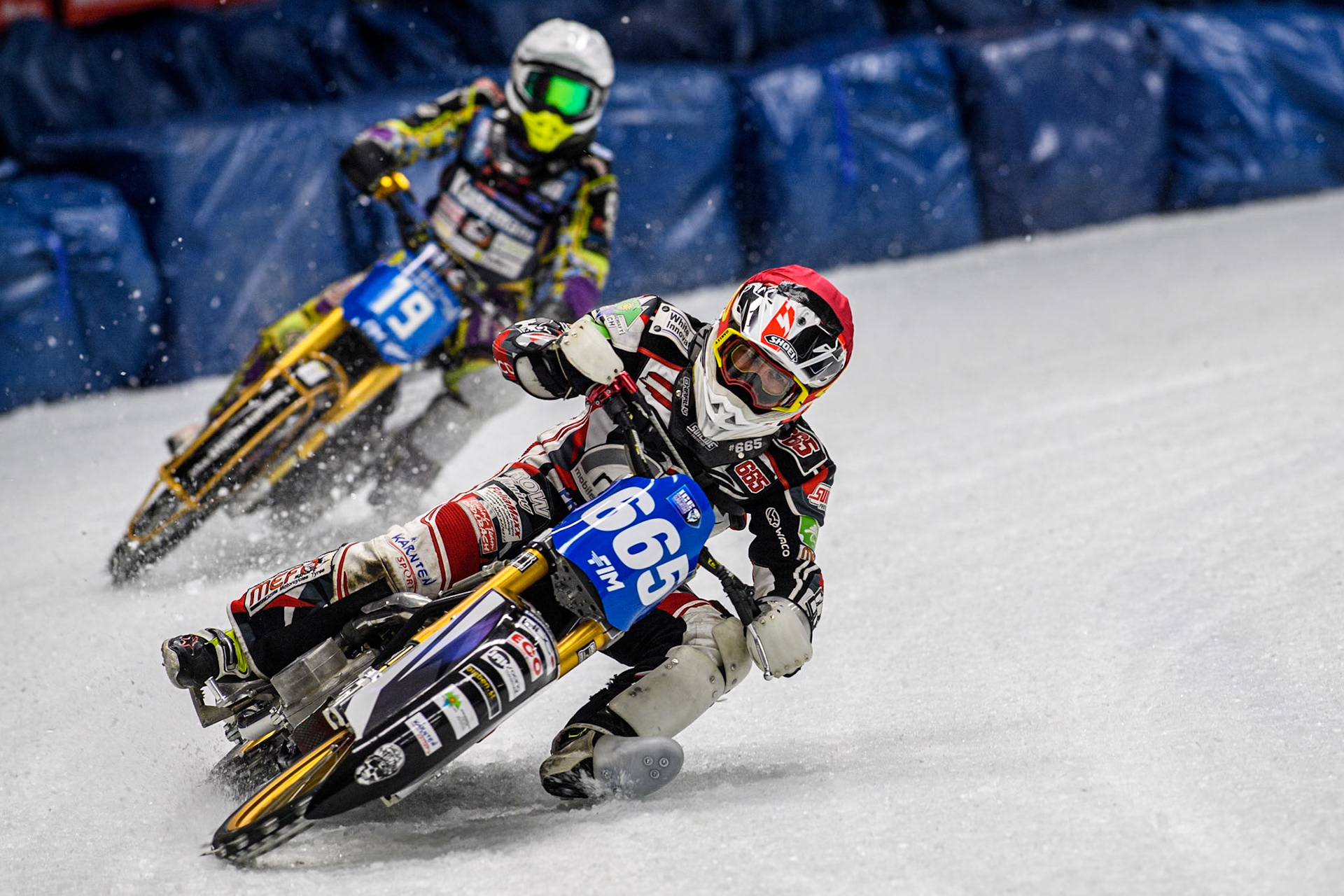Austria's Charly Ebner (665) (Red) leads  Germany's Max Niedermaier (88) (White) during the FIM Ice Speedway Gladiators World Championship Final 1 at the Max-Aicher-Arena, Inzell on Saturday 23 March 2024. (Photo: Ian Charles | MI News)
