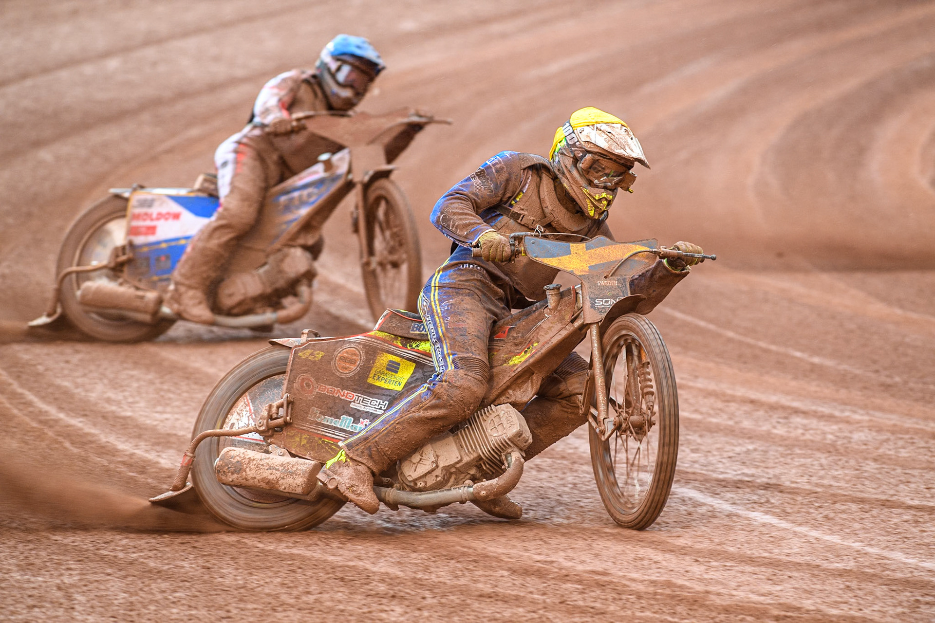Casper Henriksson of Sweden in Yellow leading Bastian Pedersen of Denmark in Blue during the Monster Energy FIM Speedway of Nations 2 (Under 21) Final at the National Speedway Stadium, Manchester on Friday 12th July 2024. (Photo: Ian Charles | MI News)
