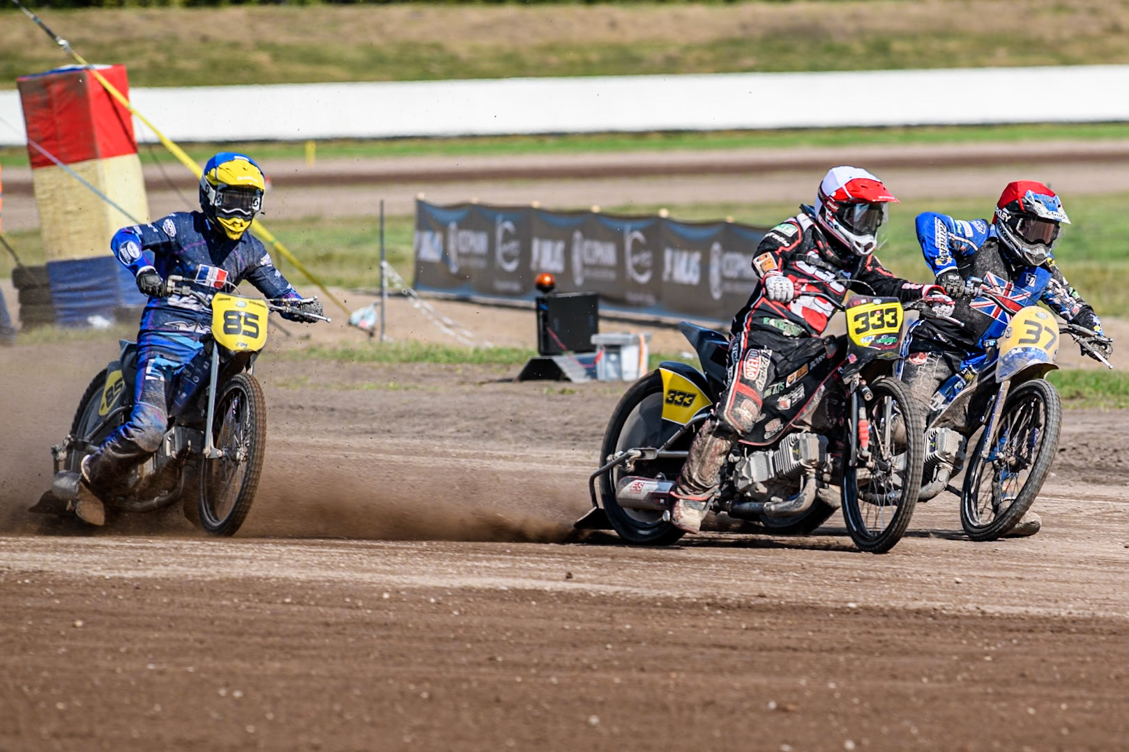 Kenneth Kruse Hansen (333) of Denmark in White rides outside Chris Harris (37)of Great Britain in Red with Jordan Dubernard (85) of France in Blue behind during the FIM Long Track World Championship Final 5 at the Speed Centre Roden, Roden, Netherlands on Sunday 22nd September 2024. (Photo: Ian Charles | MI News)