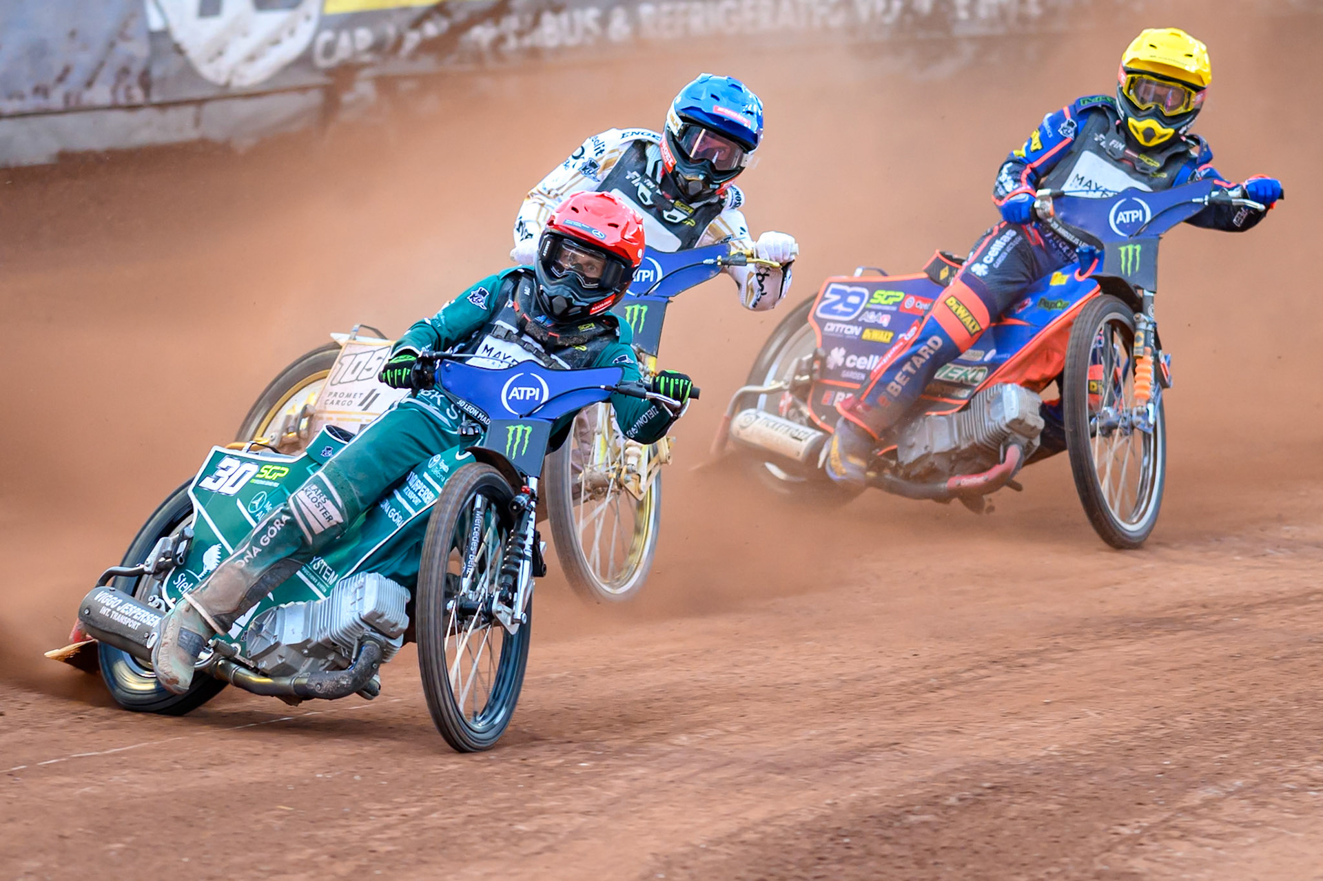 Leon Madsen (30) of Denmark in Red leading Anders Thomsen (105) of Denmark in Blue and Andzejs Lebedevs (29) of Latvia in Yellow during the ATPI  FIM Speedway GP of Manchester at the National Speedway Stadium, Manchester on Friday 5th June 2026. (Photo: Ian Charles | MI News)