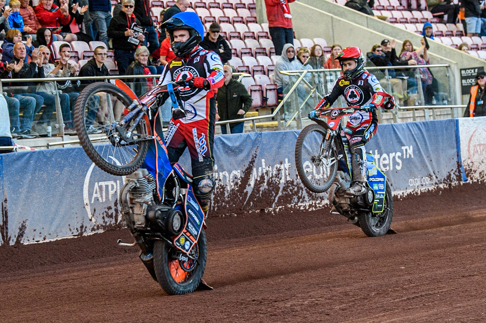 Brady Kurtz (Blue) and Jaimon Lidsey (Red) celebrates with wheelies  during the Sports Insure Premiership match between Belle Vue Aces and Ipswich Witches at the National Speedway Stadium, Manchester on Monday 5th June 2023. (Photo: Ian Charles | MI News)