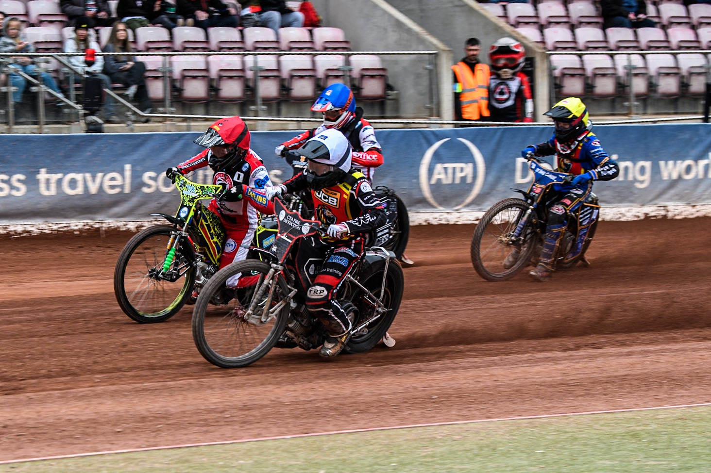 Leicester Lion Cubs' Guest Rider Ben Morley in White rides inside Belle Vue Colts' William Cairns in Red with Belle Vue Colts' Freddy Hodder in Blue and Leicester Lion Cubs' Ryan Ingram in Yellow behind during the WSRA National Development League match between Belle Vue Colts and Leicester Lion Cubs at the National Speedway Stadium, Manchester on Friday 18th April 2025. (Photo: Ian Charles | MI News)