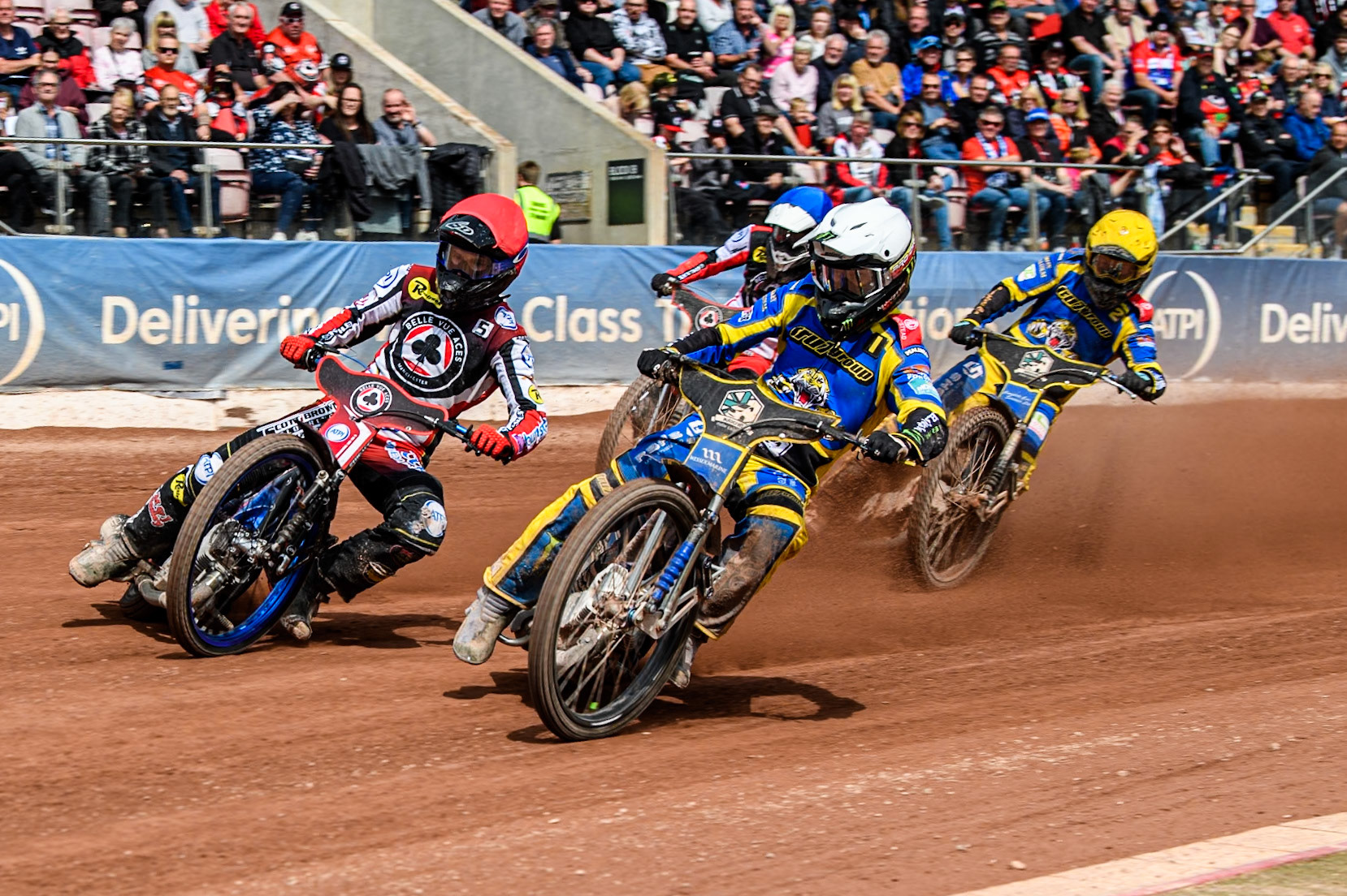 Sheffield Tigers' Jack Holder  in White rides inside Belle Vue Aces' Brady Kurtz  in Red with Sheffield Tigers' Kyle Howarth  in Yellow and Belle Vue Aces' Antti Vuolas  in Blue behind  during the Rowe Motor Oil Premiership match between Belle Vue Aces and Sheffield Tigers at the National Speedway Stadium, Manchester on Monday 26th August 2024. (Photo: Ian Charles | MI News)
