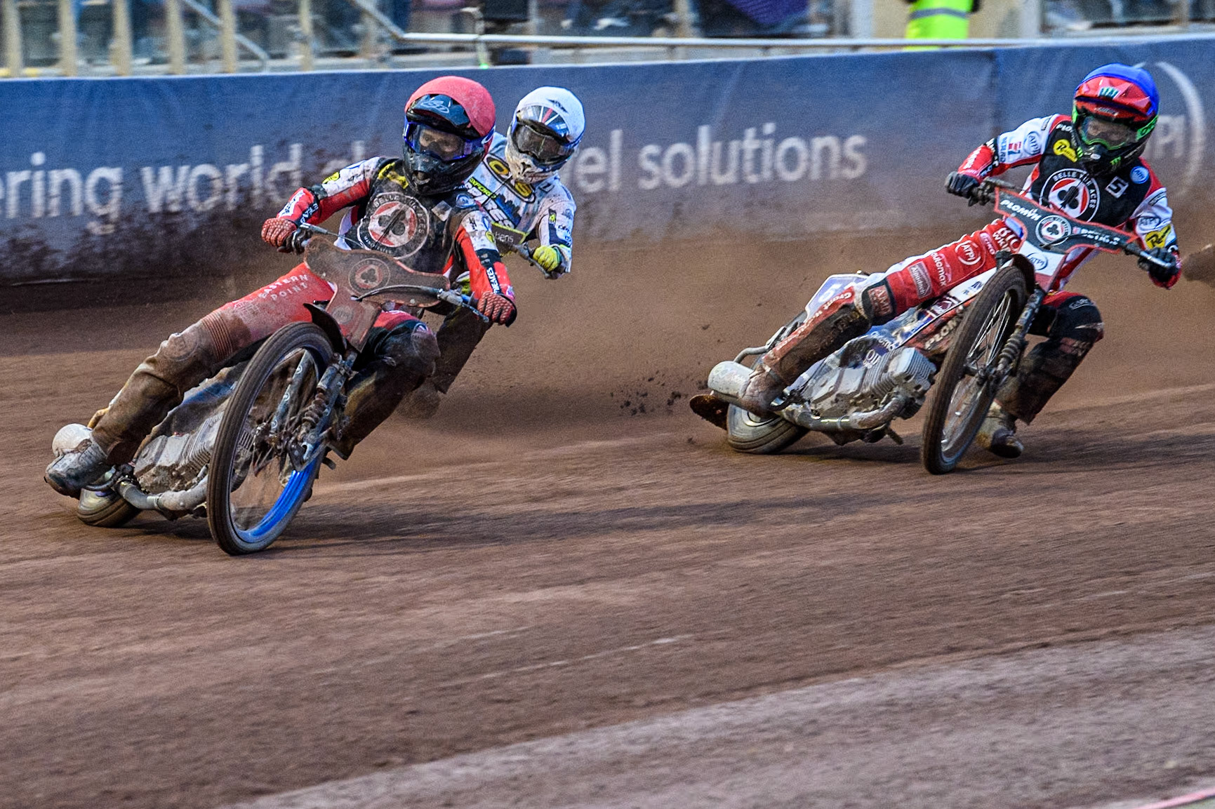 Belle Vue Aces' Brady Kurtz in Red leading Belle Vue Aces' Dan Bewley in Blue and Oxford Spires' Rohan Tungate in White during the Rowe Motor Oil Premiership match between Belle Vue Aces and Oxford Spires at the National Speedway Stadium, Manchester on Monday 13th May 2024. (Photo: Ian Charles | MI News)