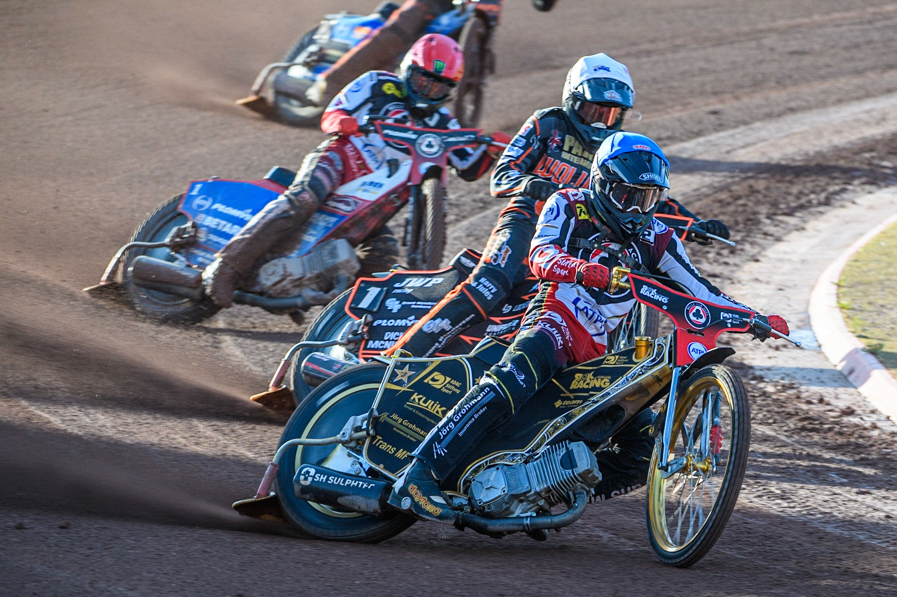 Norick Blodorn (Blue) leads Sam Masters (White) and Dan Bewley (Red) during the Sports Insure Premiership match between Belle Vue Aces and Wolverhampton Wolves at the National Speedway Stadium, Manchester on Monday 3rd July 2023. (Photo: Ian Charles | MI News)