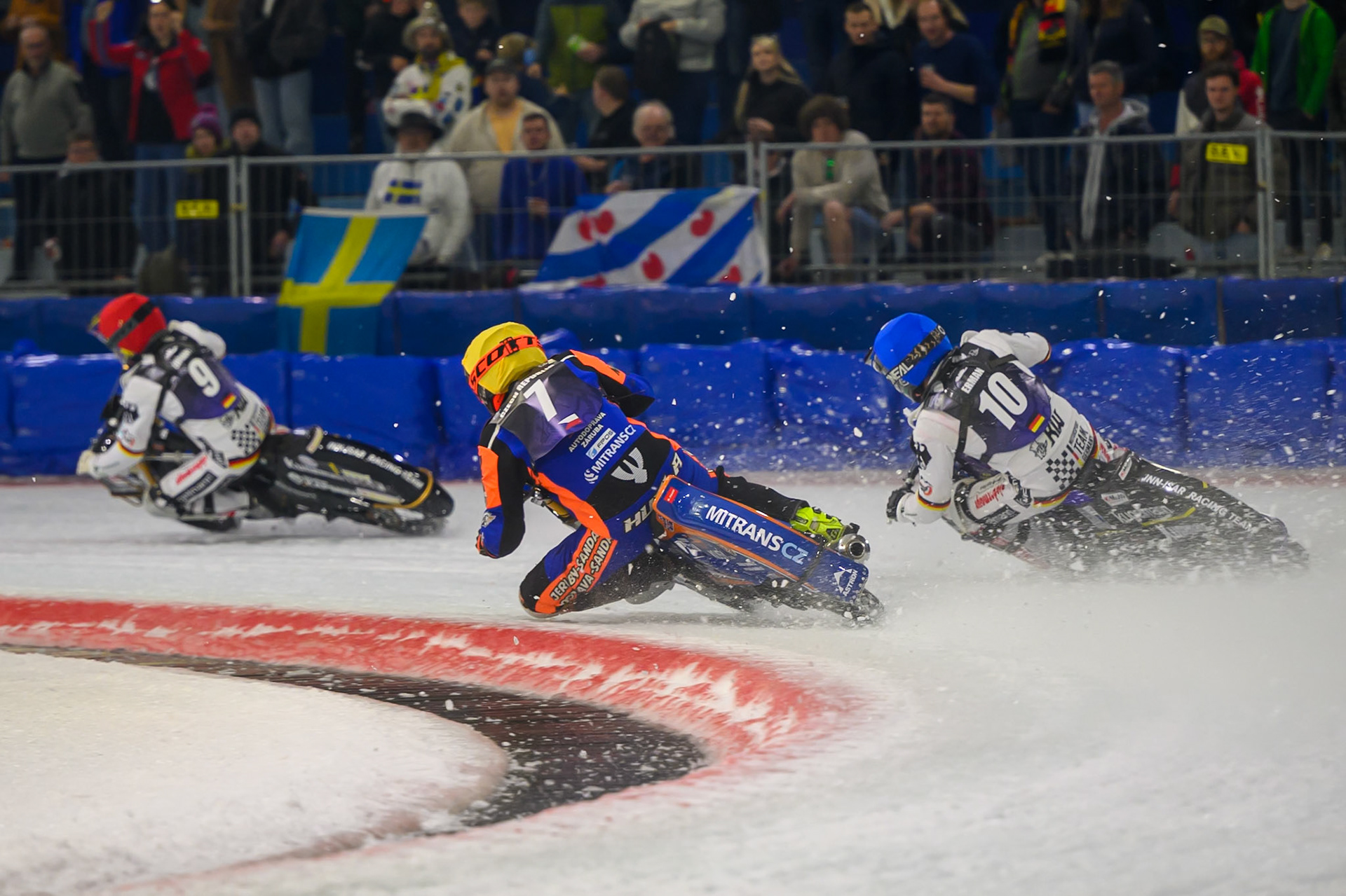Lukáš Hutla (7) of Czechia  in Yellow rides inside Christoph Kirchner (10) of Germany in Blue as they both chase Max Niedermaier (9) of Germany  in Red during the FIM Ice Speedway Of Nations at Ice Rink Thialf, Heerenveen on Sunday 12th April 2026. (Photo: Ian Charles | MI News)